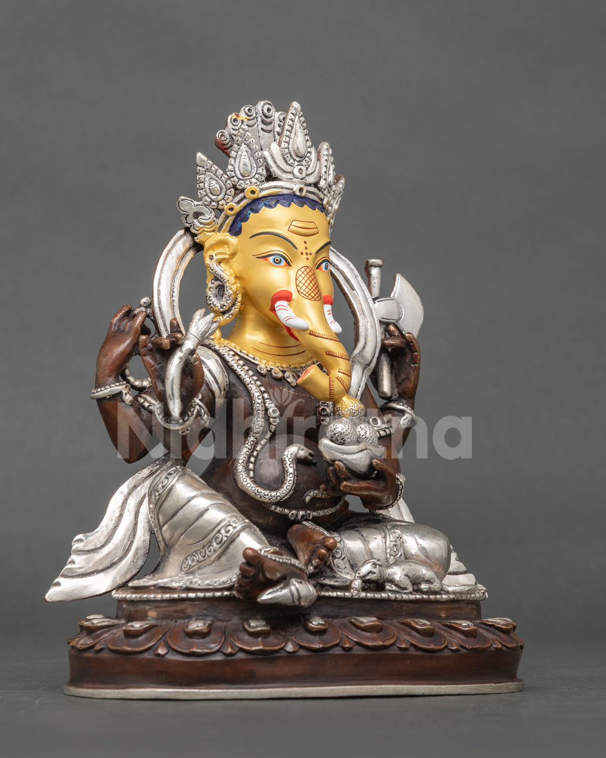 Ganesh statue right view four armed Lord Ganesha lotus pedestal oxidized copper silver plated finish.