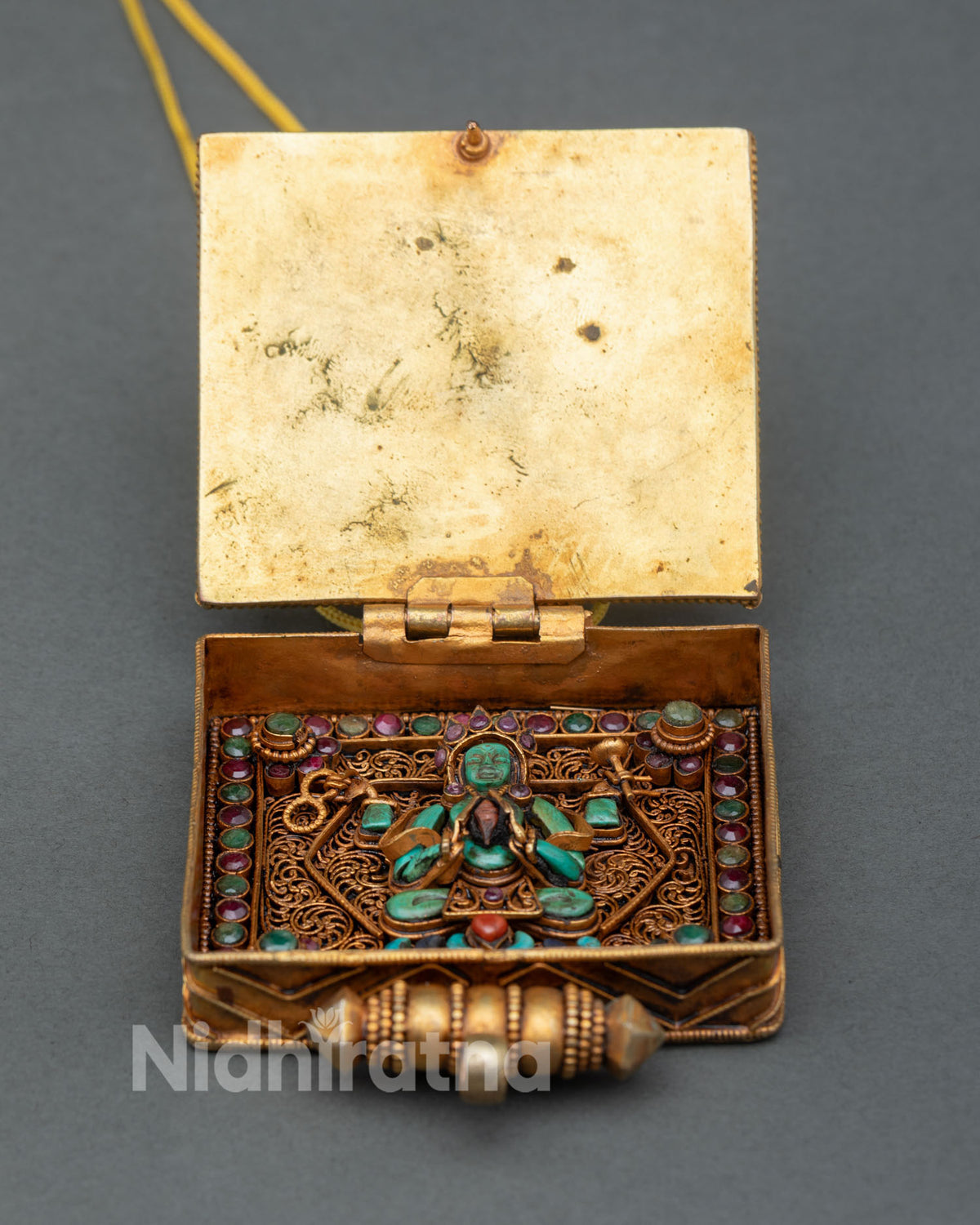 Ghau Box portable shrine showing a hand-carved Chenrezig inside a filigree chamber