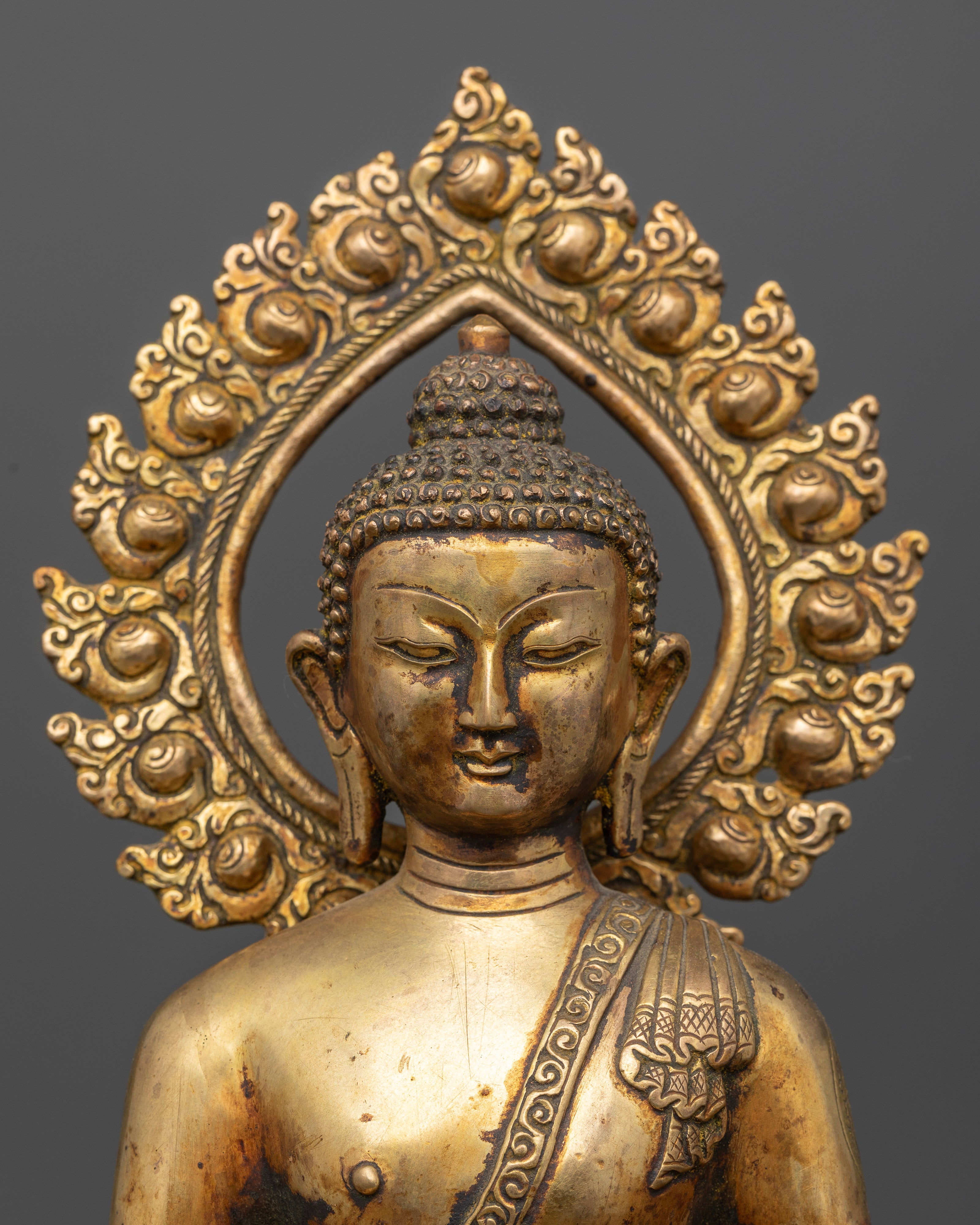 Gold fire gilded Amitabha Buddha statue with antique copper finish.