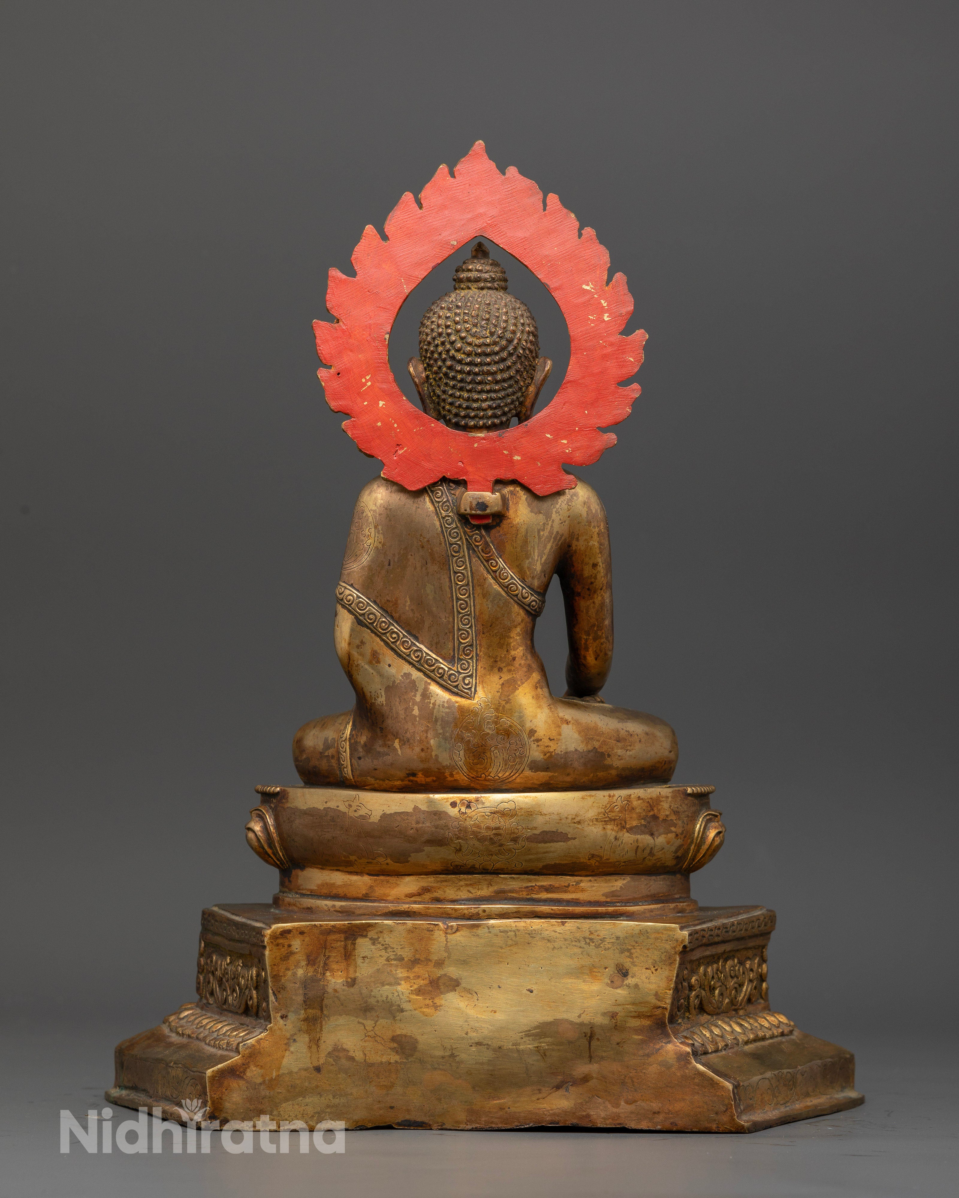 Gold-fire gilded Shakyamuni Buddha statue with antique copper finish.