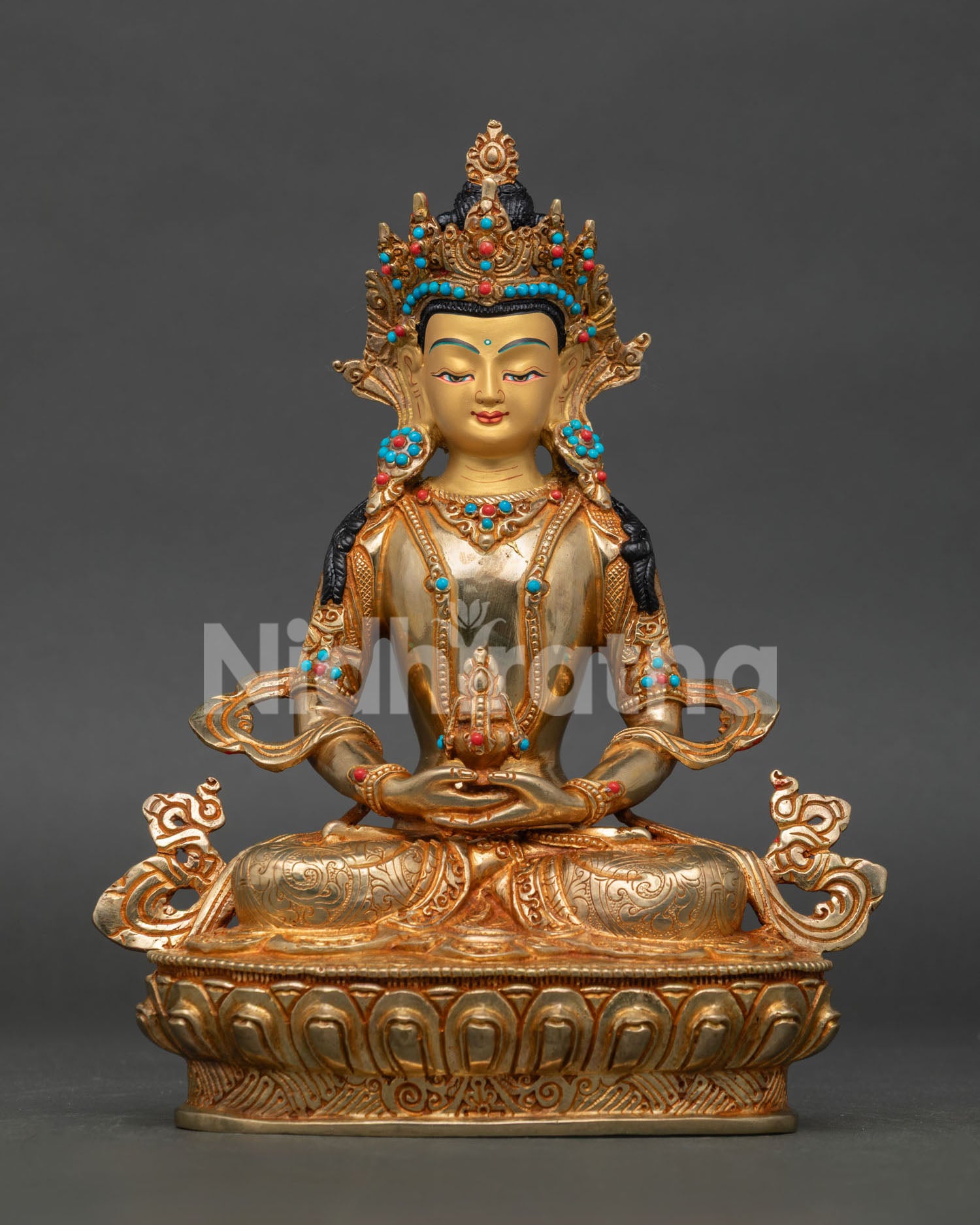 Gold gilded Amitayus Buddhist sculpture with flowing robes and nepalese craftsmanship.
