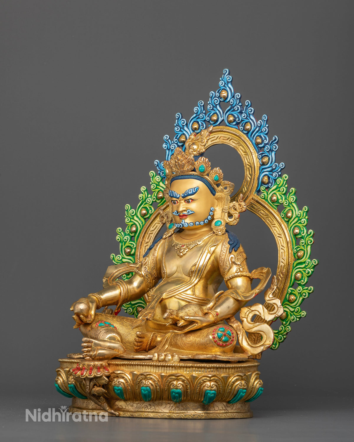 Gold gilded Dzambhala sculpture with gold painted face five shell crown and ornate jewelry