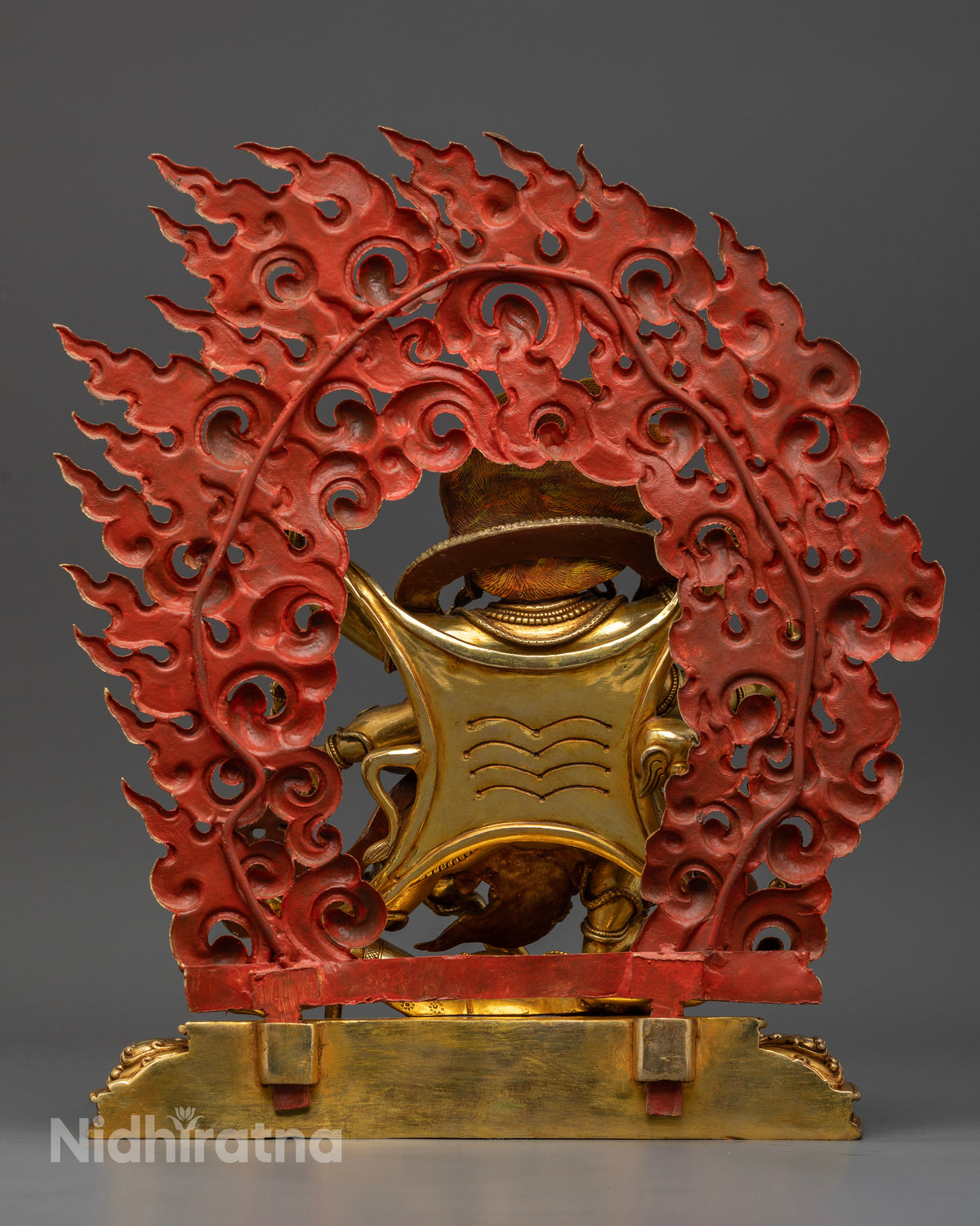 Gold gilded Six-Armed Mahakala Buddhist protector statue with blazing halo.