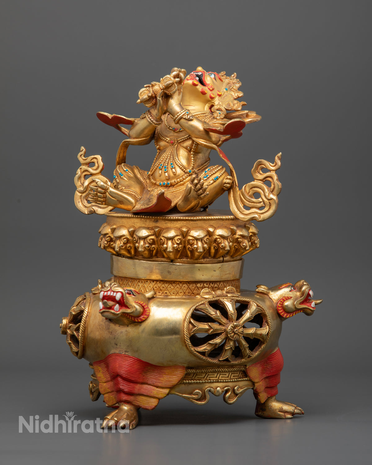 Gold gilded Vajradhaka statue on three sided tiger leg support.
