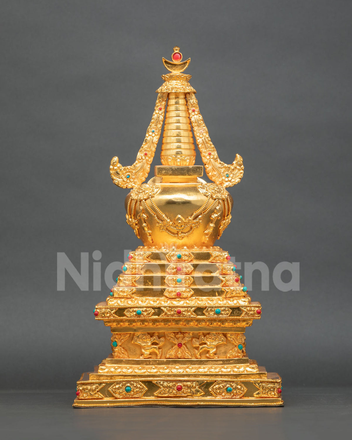 Gold-plated Buddhist Stupa representing enlightenment and wisdom with detailed Himalayan craftsmanship