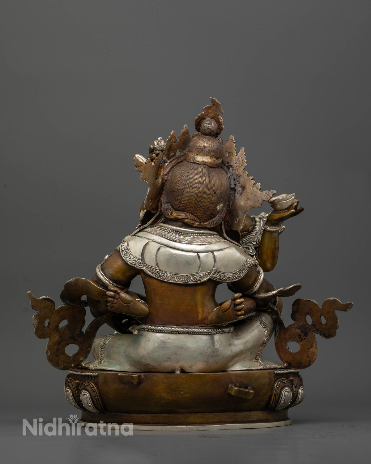 Green Dzambhala statue crafted using traditional lost wax casting method