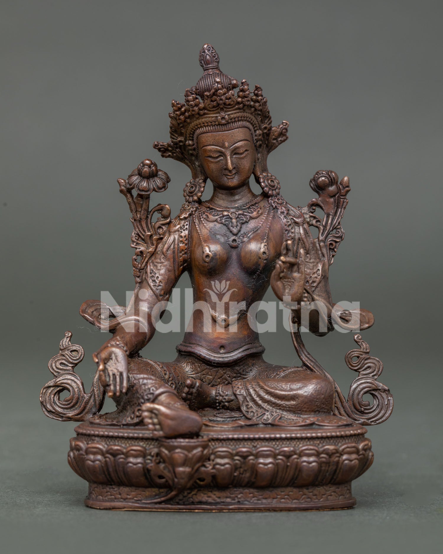 Green Tara Bodhisattva Statue seated on lotus throne holding lotus stem with Three Jewels gesture.