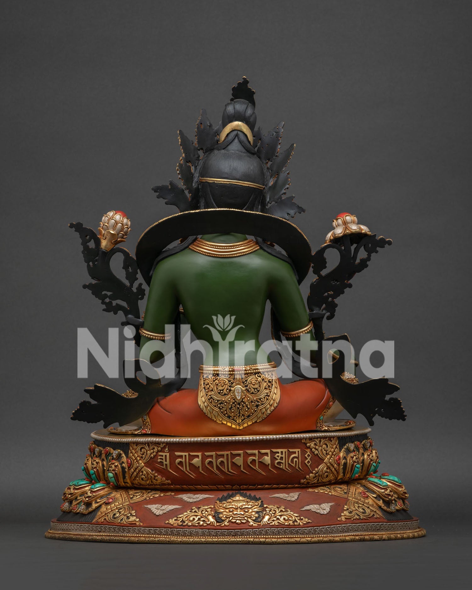 Green Tara Buddhist altar sculpture back showing gold-gilded mantra inscription and kirtimukha guardian face
