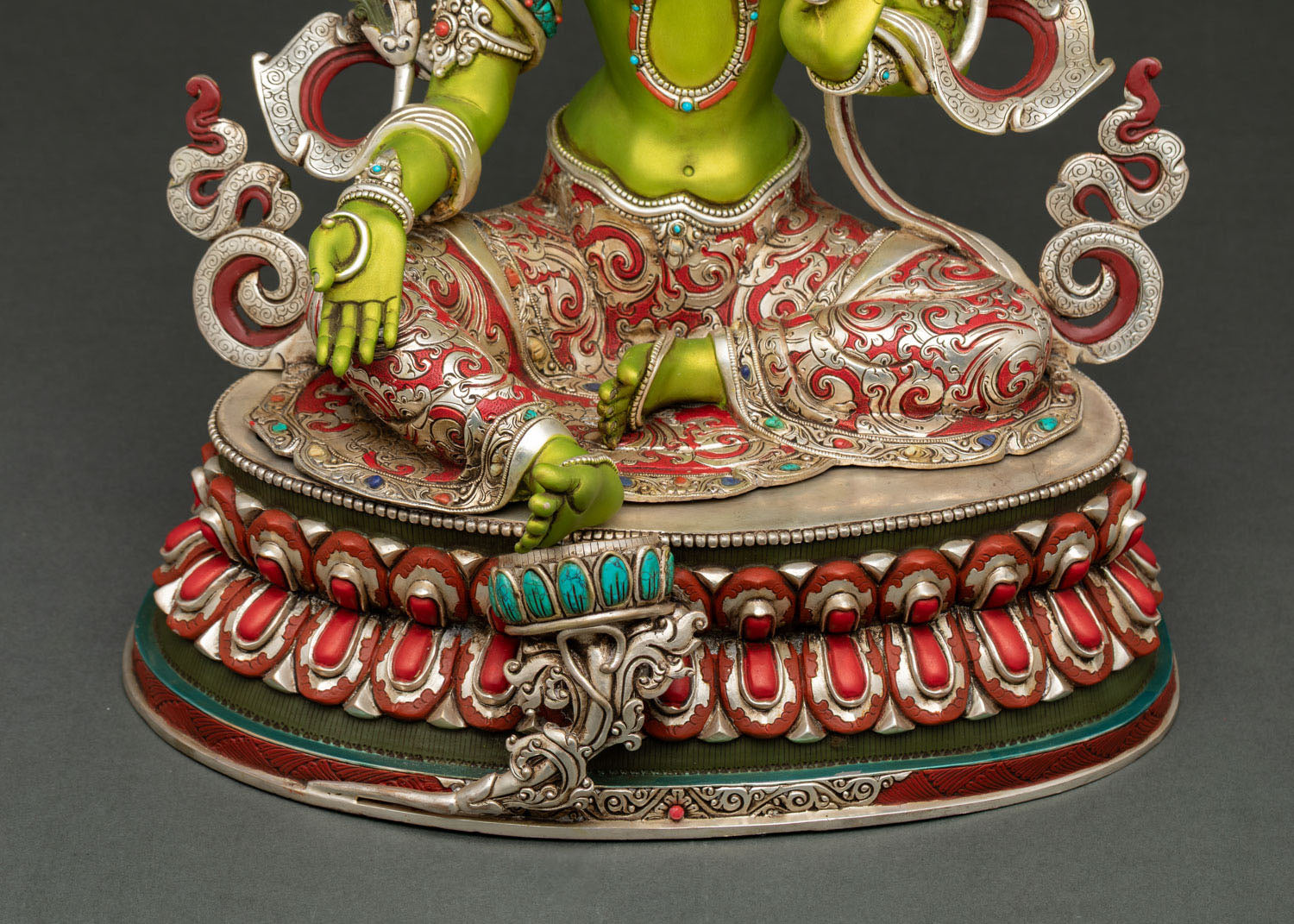 Green Tara Buddhist goddess statue crafted by Newari artisan featuring traditional Nepali metalwork