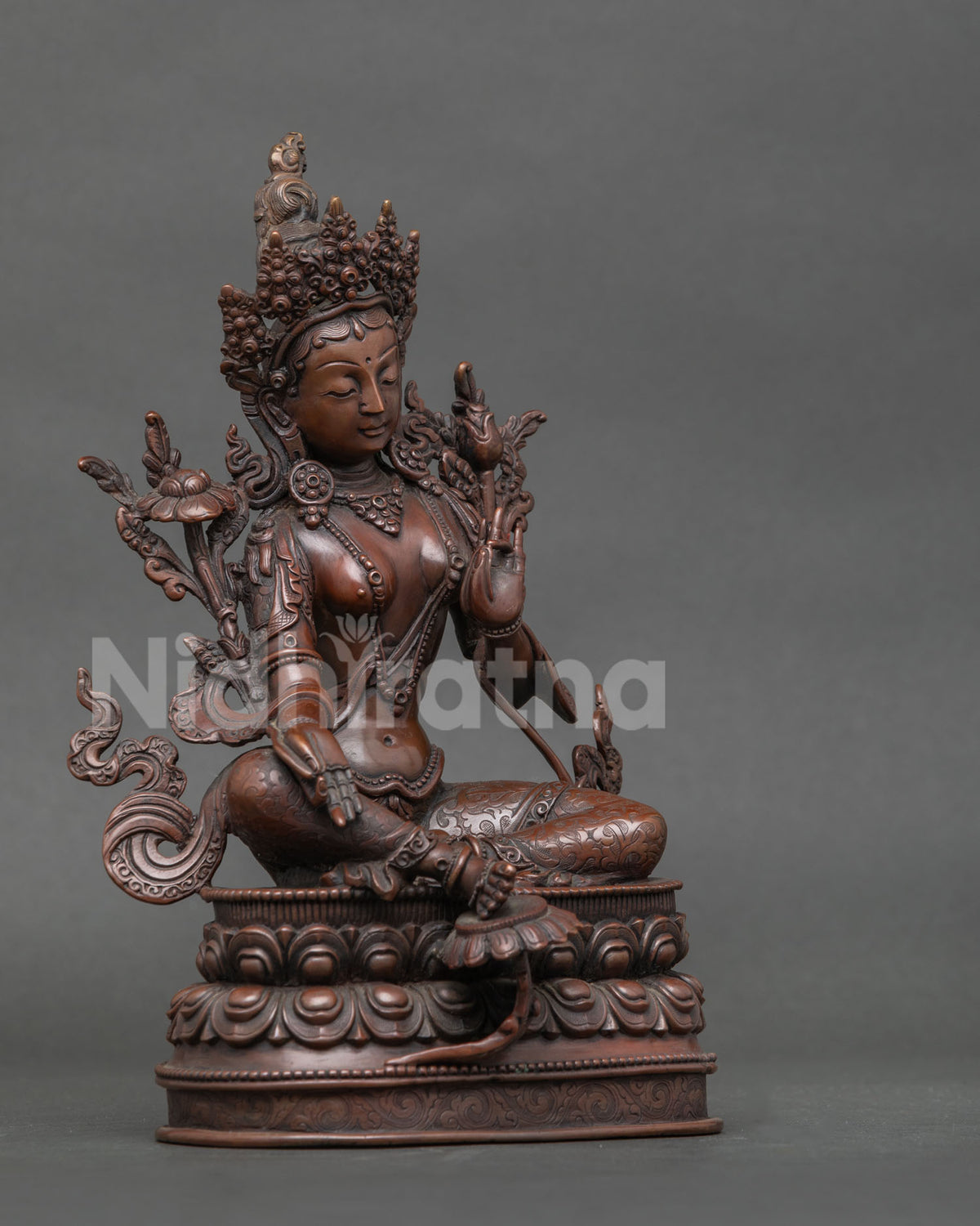 Green tara buddhist statue in copper with chemically oxidized finish from patan nepal.