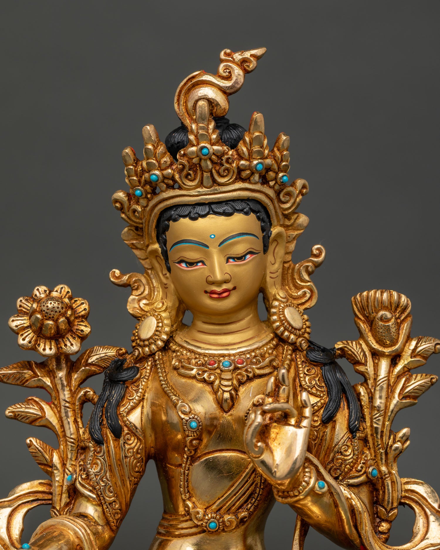 Green Tara Buddhist statue with gold painted face and intricate Newari craftsmanship