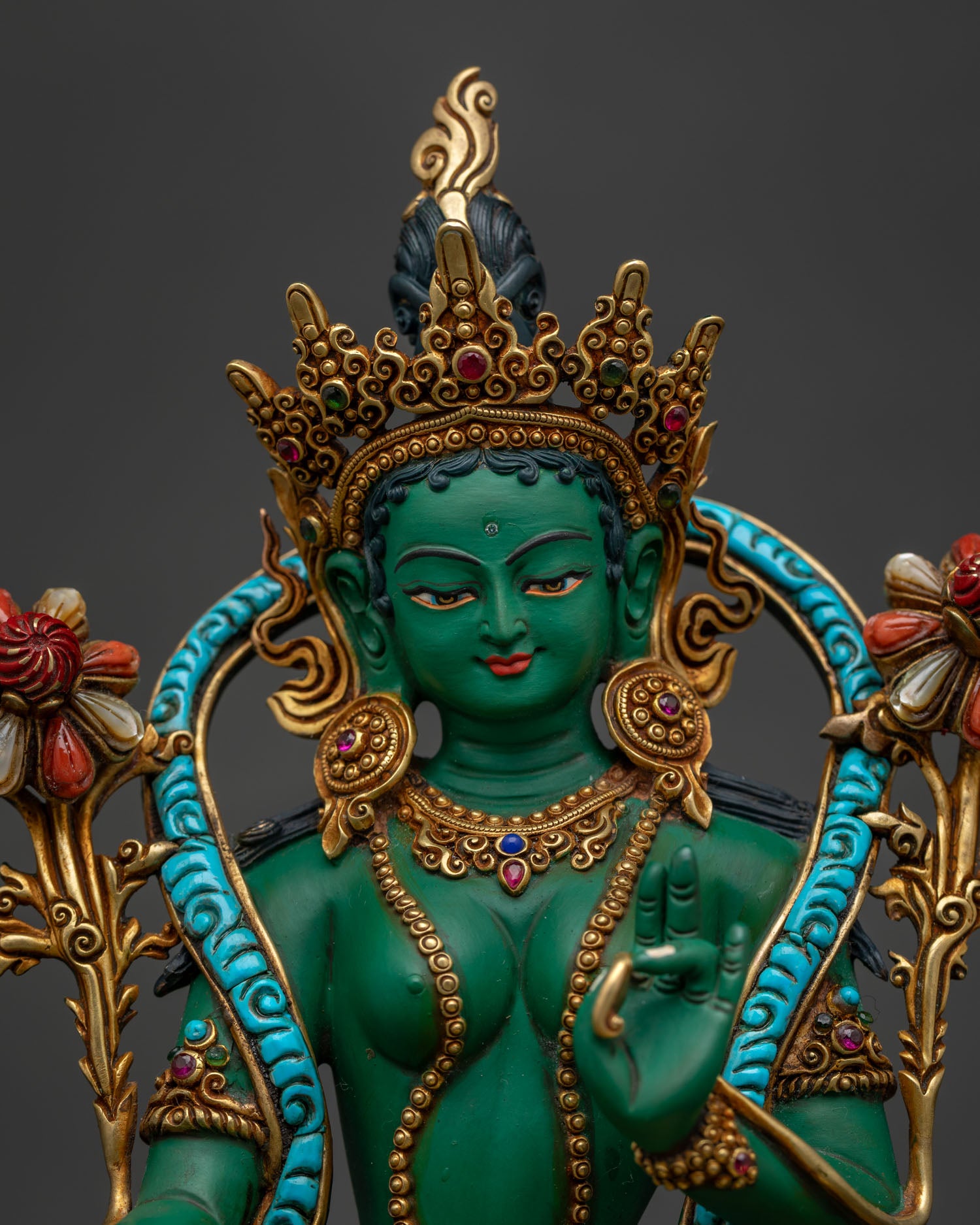 Green Tara close-up — gold-gilded crown, turquoise robe, gem lotus base and copper craftsmanship