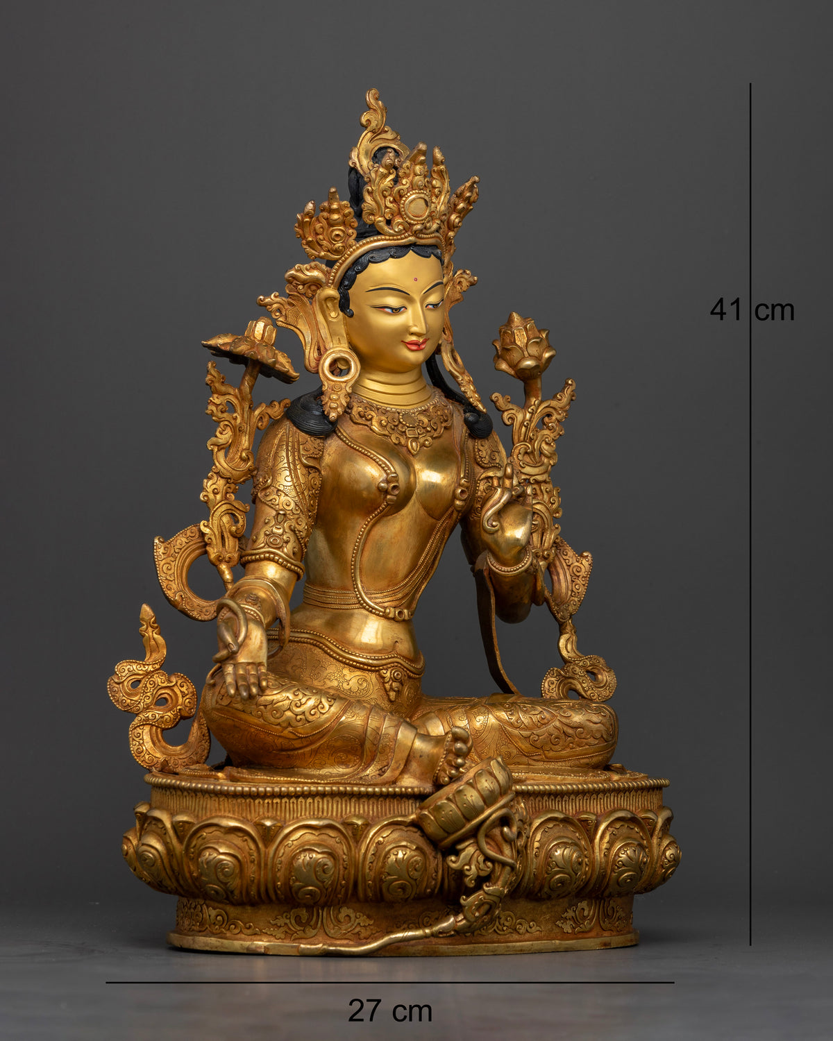 Green Tara seated in Lalitasana on carved lotus pedestal with 24K gold painted face.