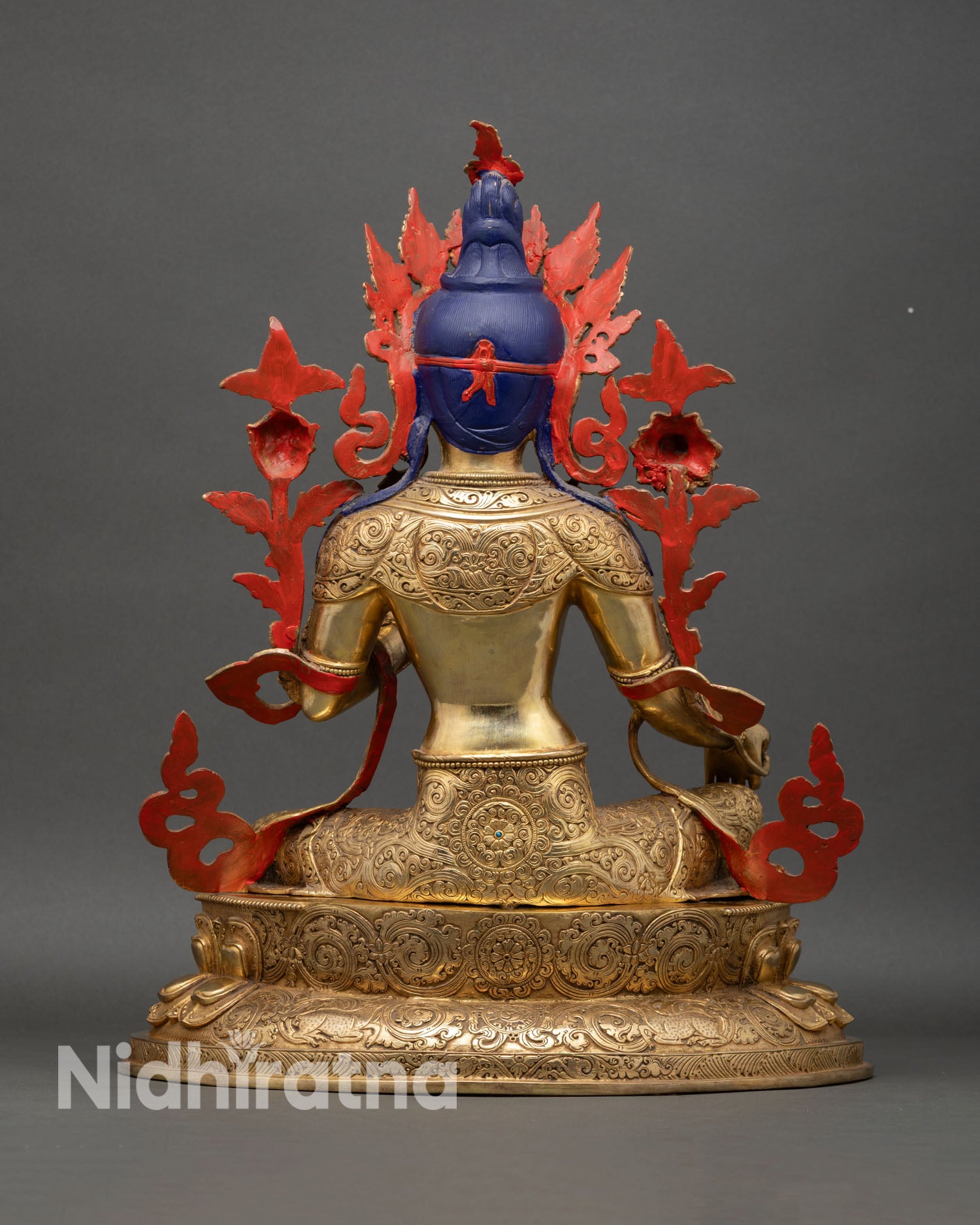 Green Tara statue back view, finely detailed carving with ornate patterns and sacred craftsmanship