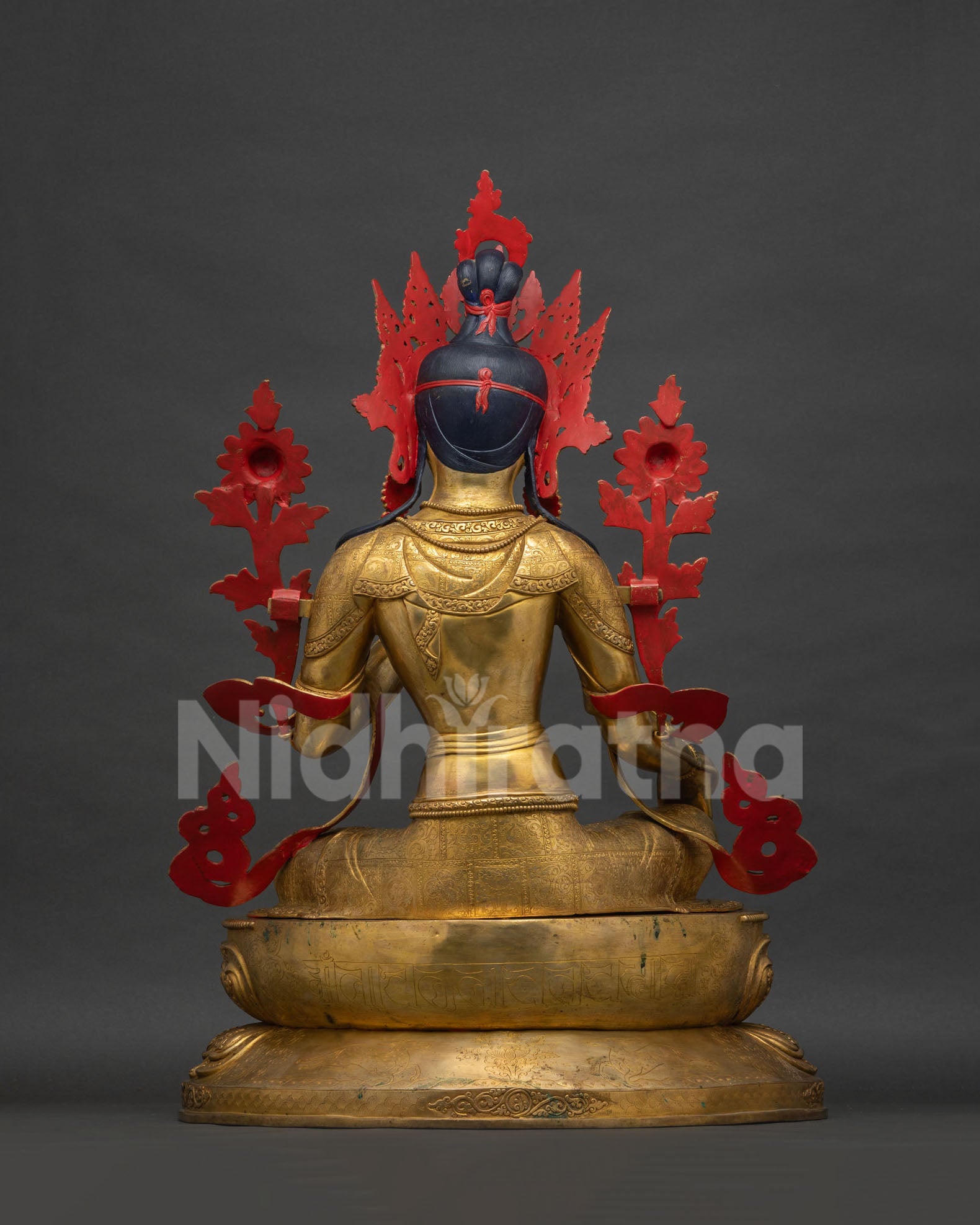 Green Tara Statue back view, gold gilded crown and engraved robe detail