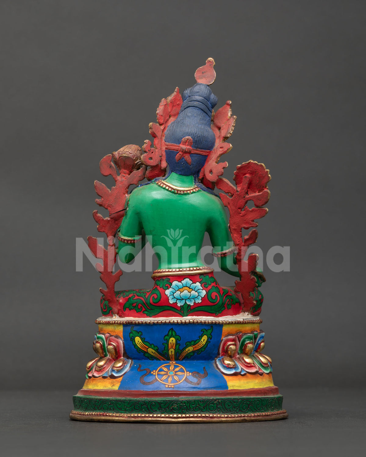 Green Tara statue back view with hand-painted lotus pedestal and Dharma wheel, made in Nepal