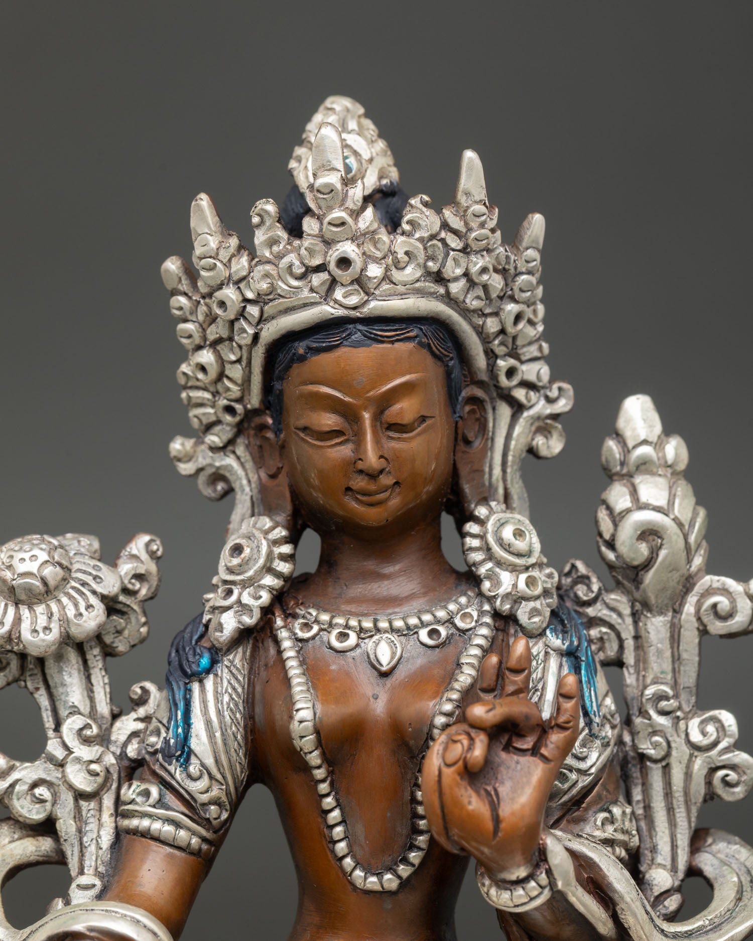 Green Tara statue close up detail crown jewelry Utpala flower copper silver Nepal art