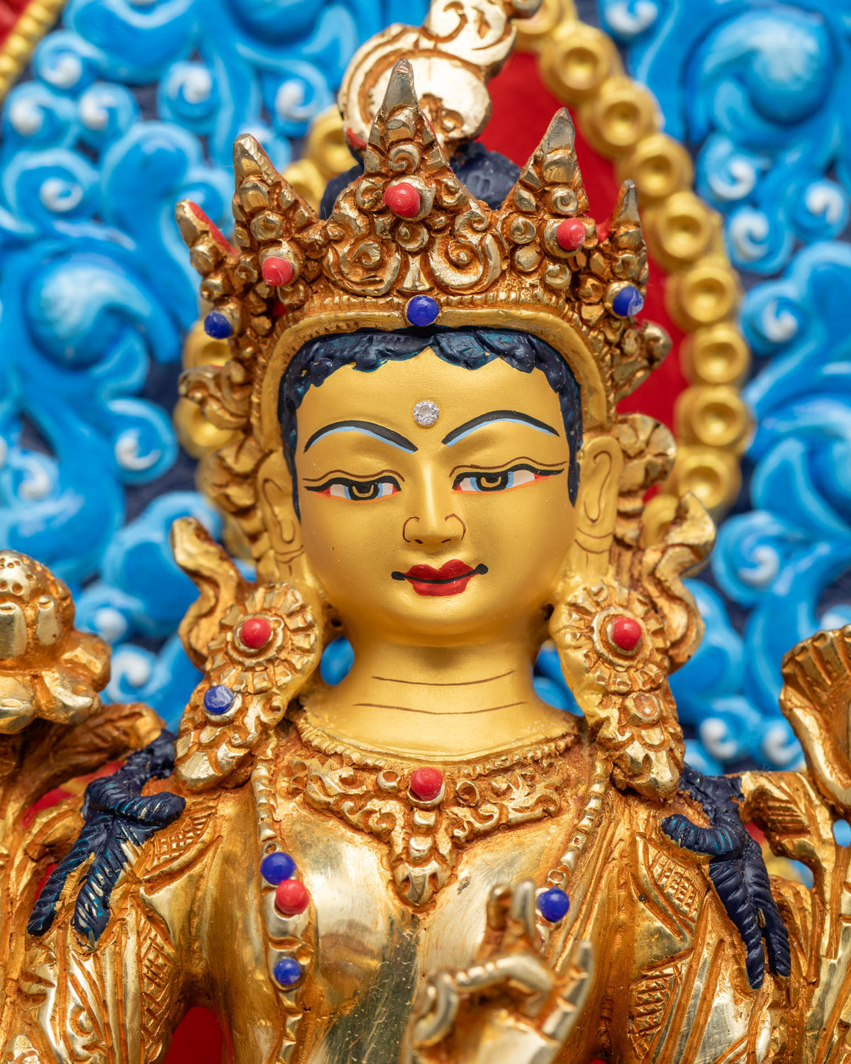 Green Tara Statue Face Close-up - Hand-Painted Gold Buddhist Sculpture