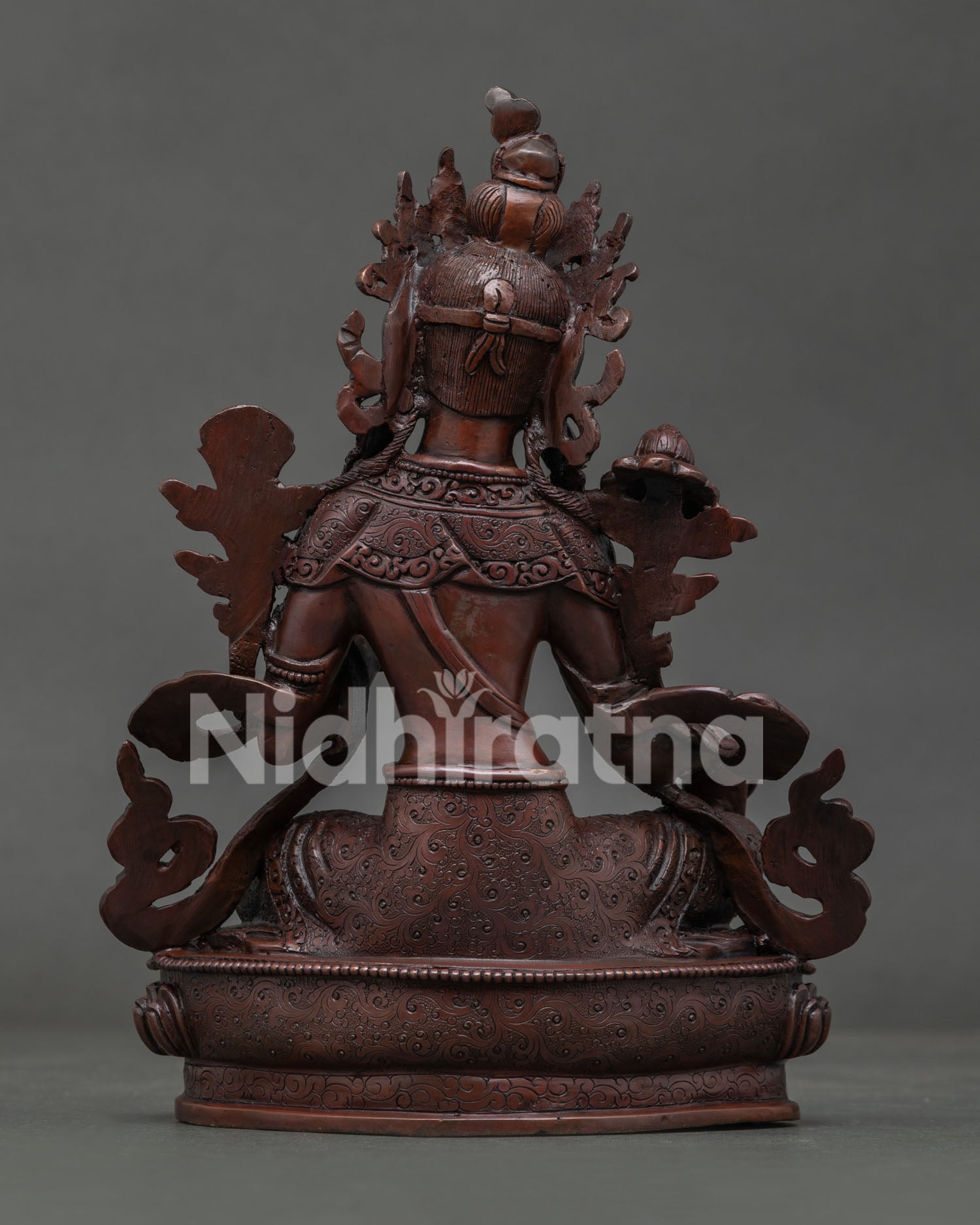 Green Tara Statue handcrafted by Newari artisans in Patan Nepal with oxidized copper finish.
