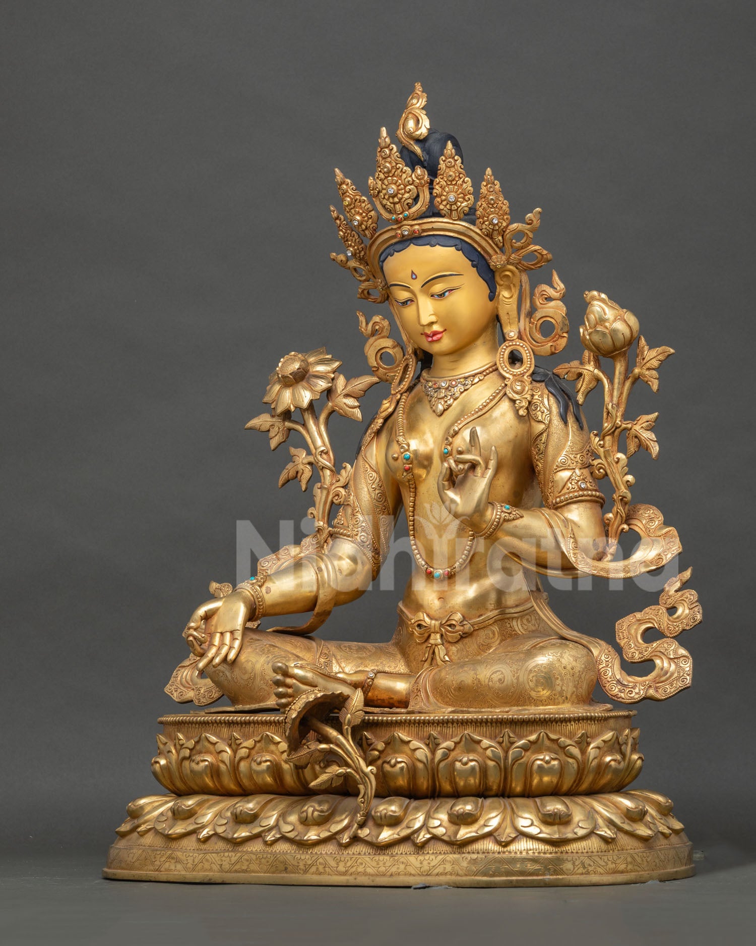 Green Tara Statue left side view – Varada Mudra hand holding utpala lotus stem