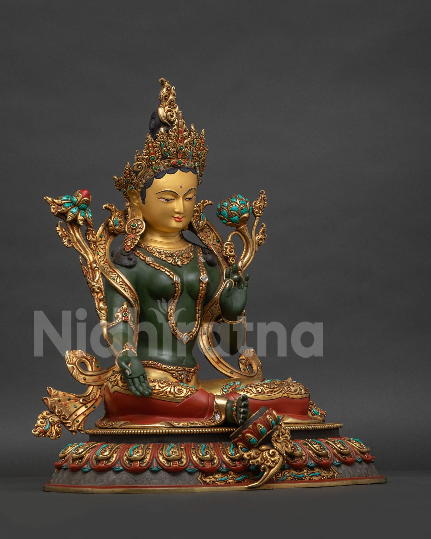 Green Tara statue right side view showing utpala lotus hand and ornamental details