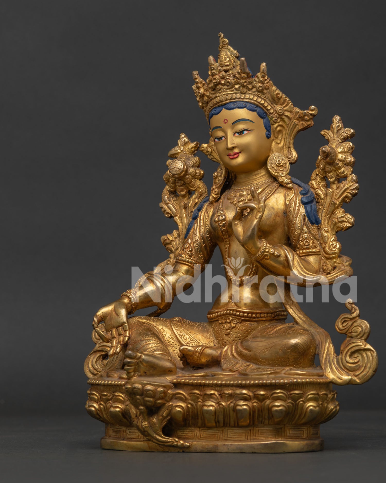 Green Tara Statue Seated on Lotus Pedestal with Vajra Carving Side View.