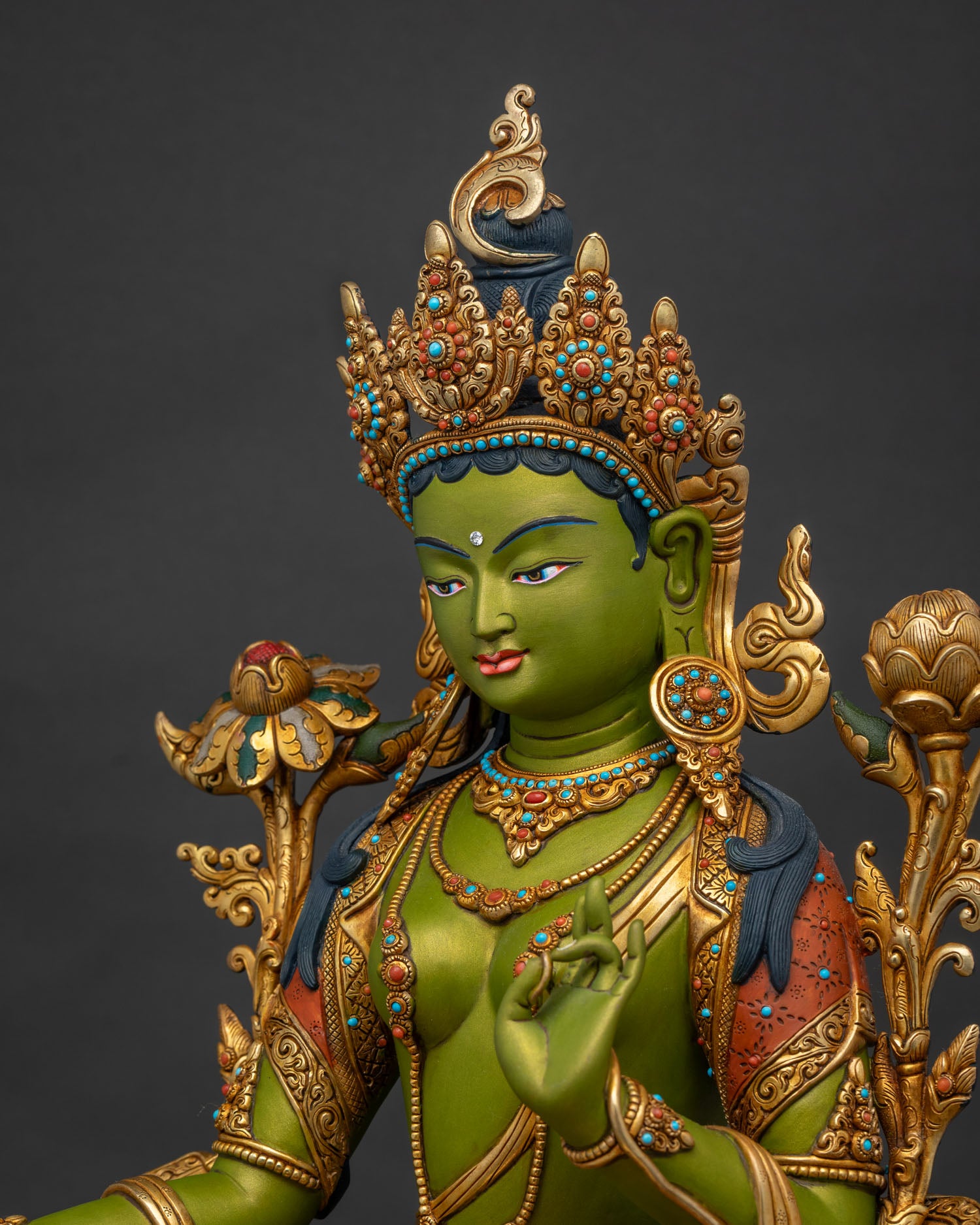 Green Tara statue side close-up – detailed gold-gilded copper craftsmanship