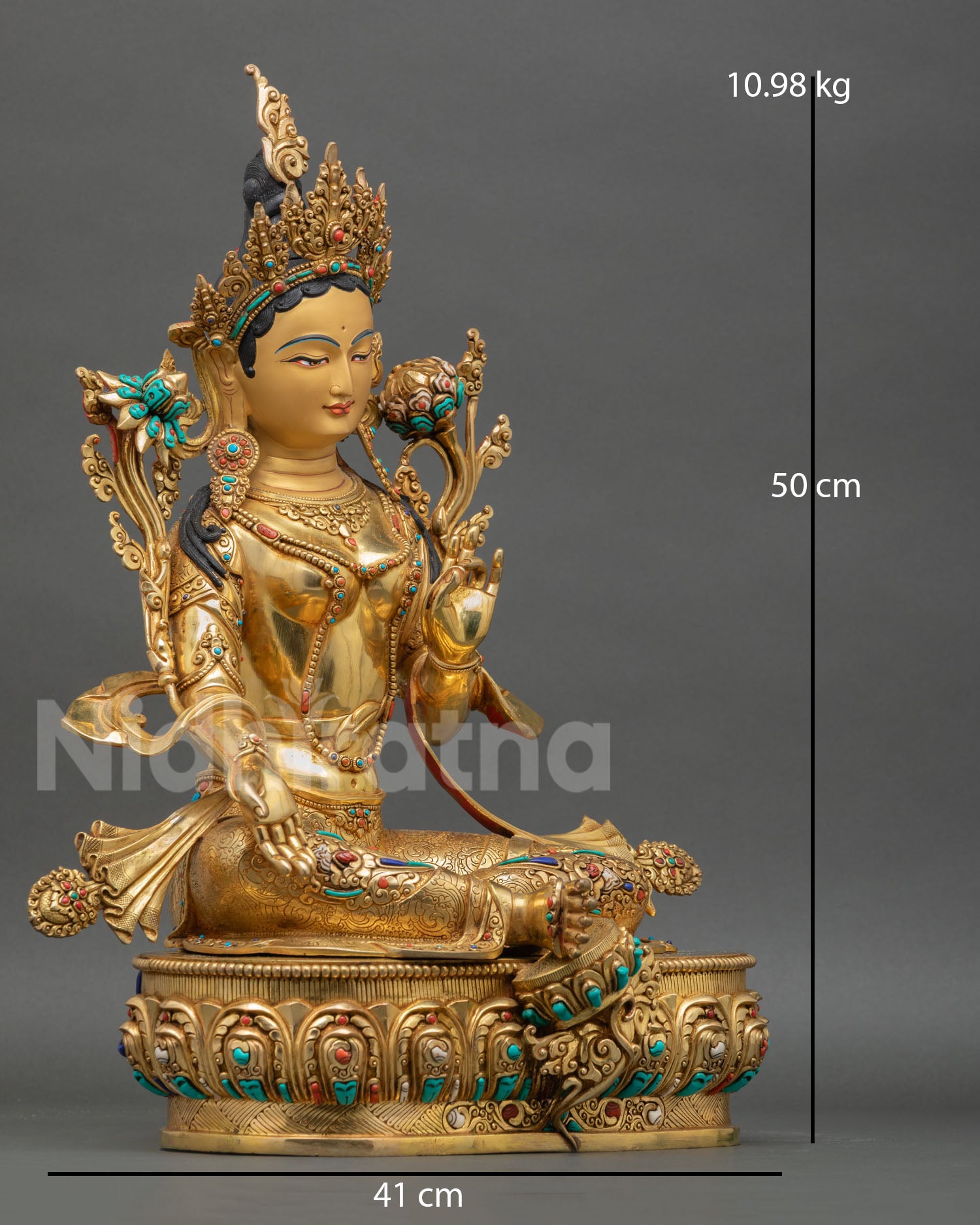 Green Tara statue side view with lotus seat, radiant 24K gold detailing, and traditional Tibetan Buddhist symbolism for protection and compassion.