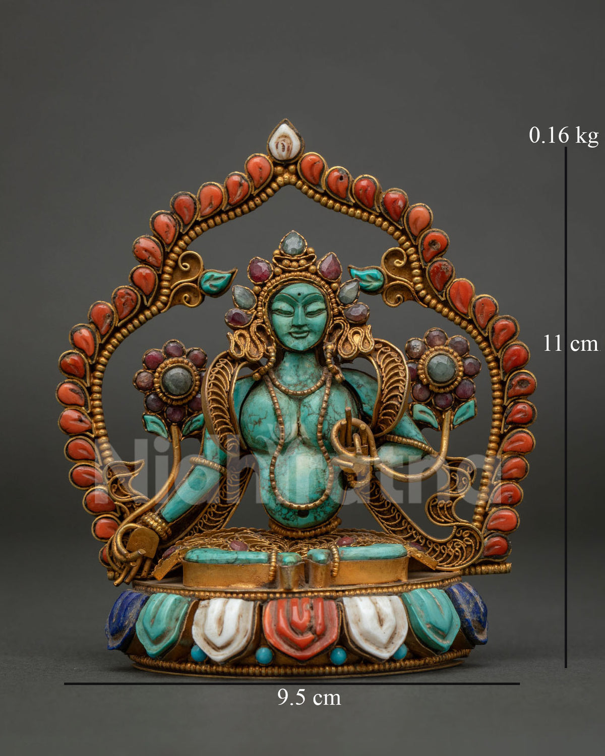 green tara turquoise statue from nepal with coral halo and utpala flowers front view