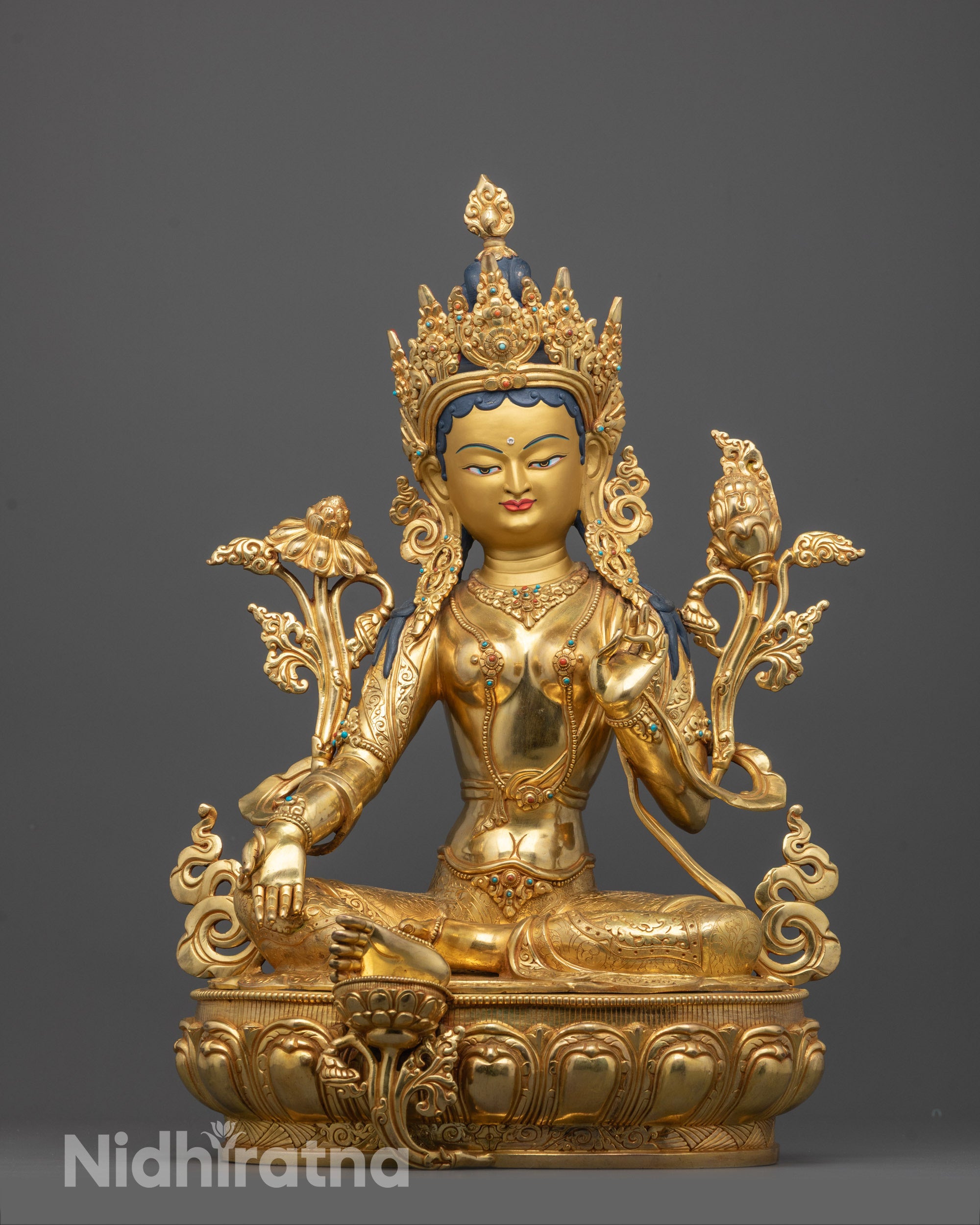green tara statue front view showing gold-gilded face and lotus seat with detailed ornaments
