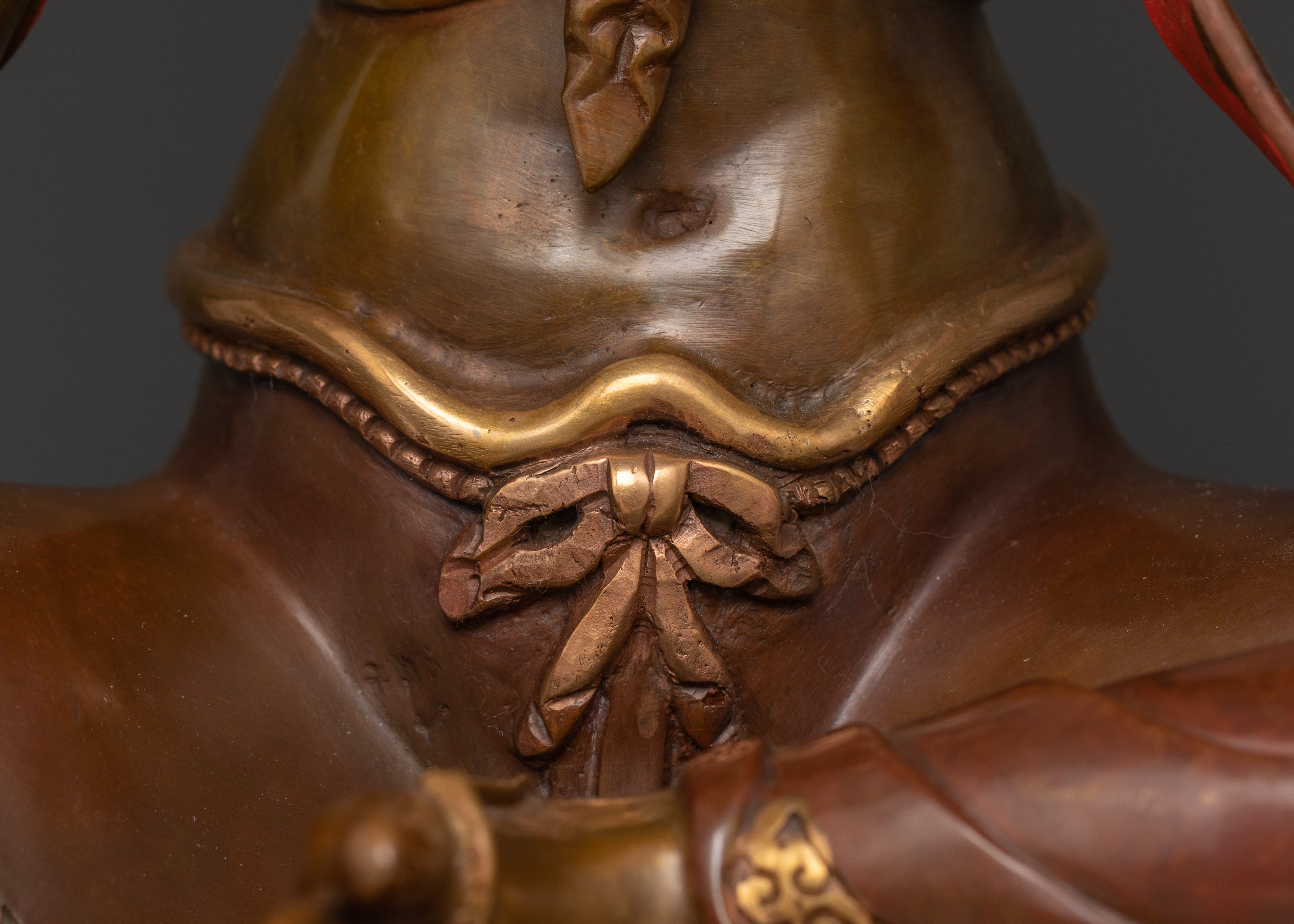 the torso of oxidized copper green tara statue