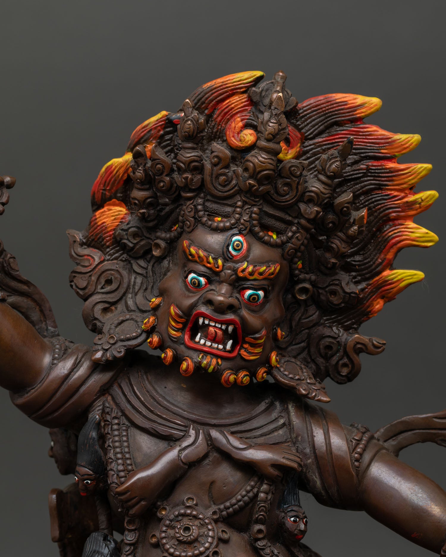 Guru Dragpo statue close up view third eye fierce expression vajra sacred Himalayan Buddhist art detail