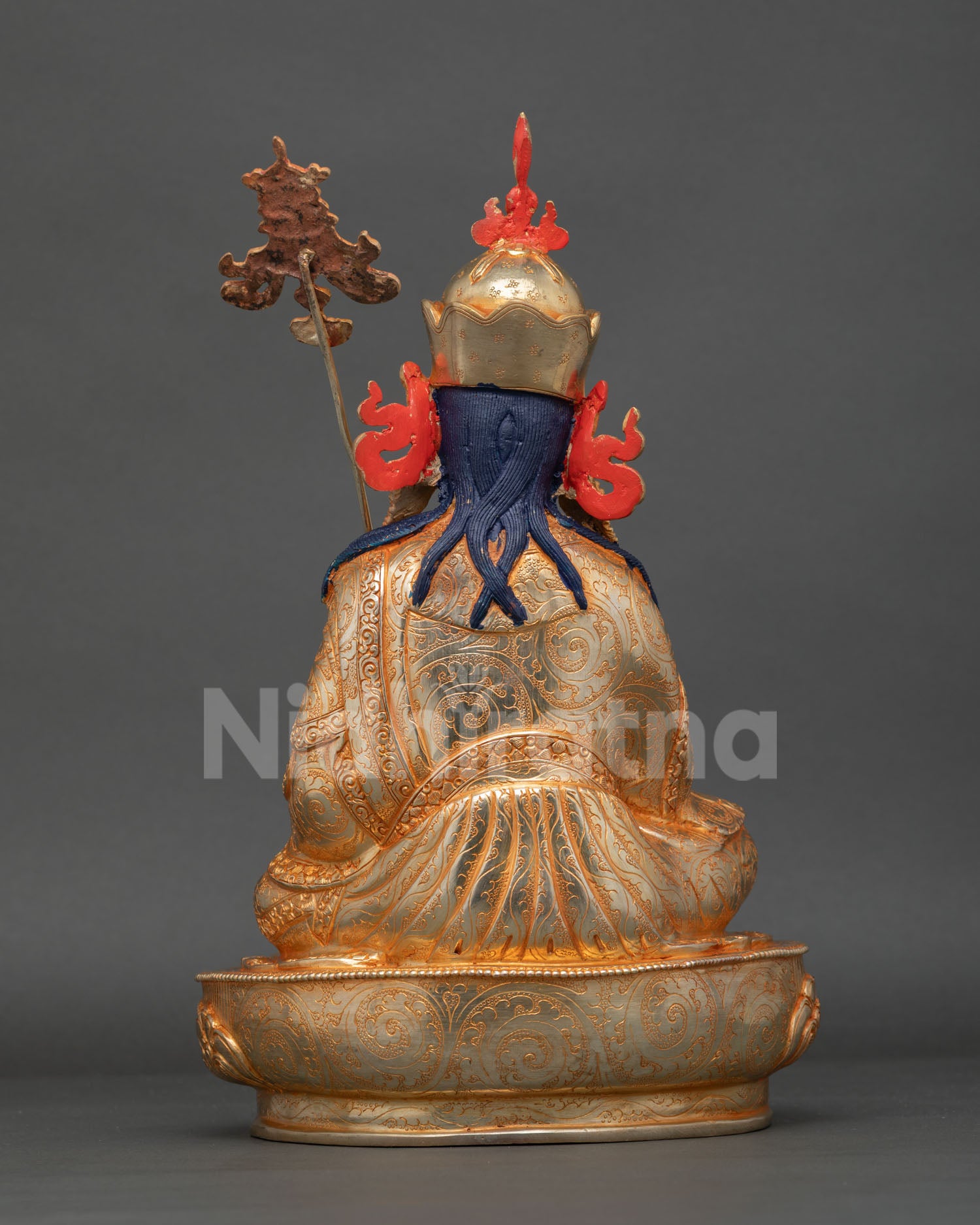 back view guru norlha statue detailed engraved robes lotus throne copper fire gilded artistry