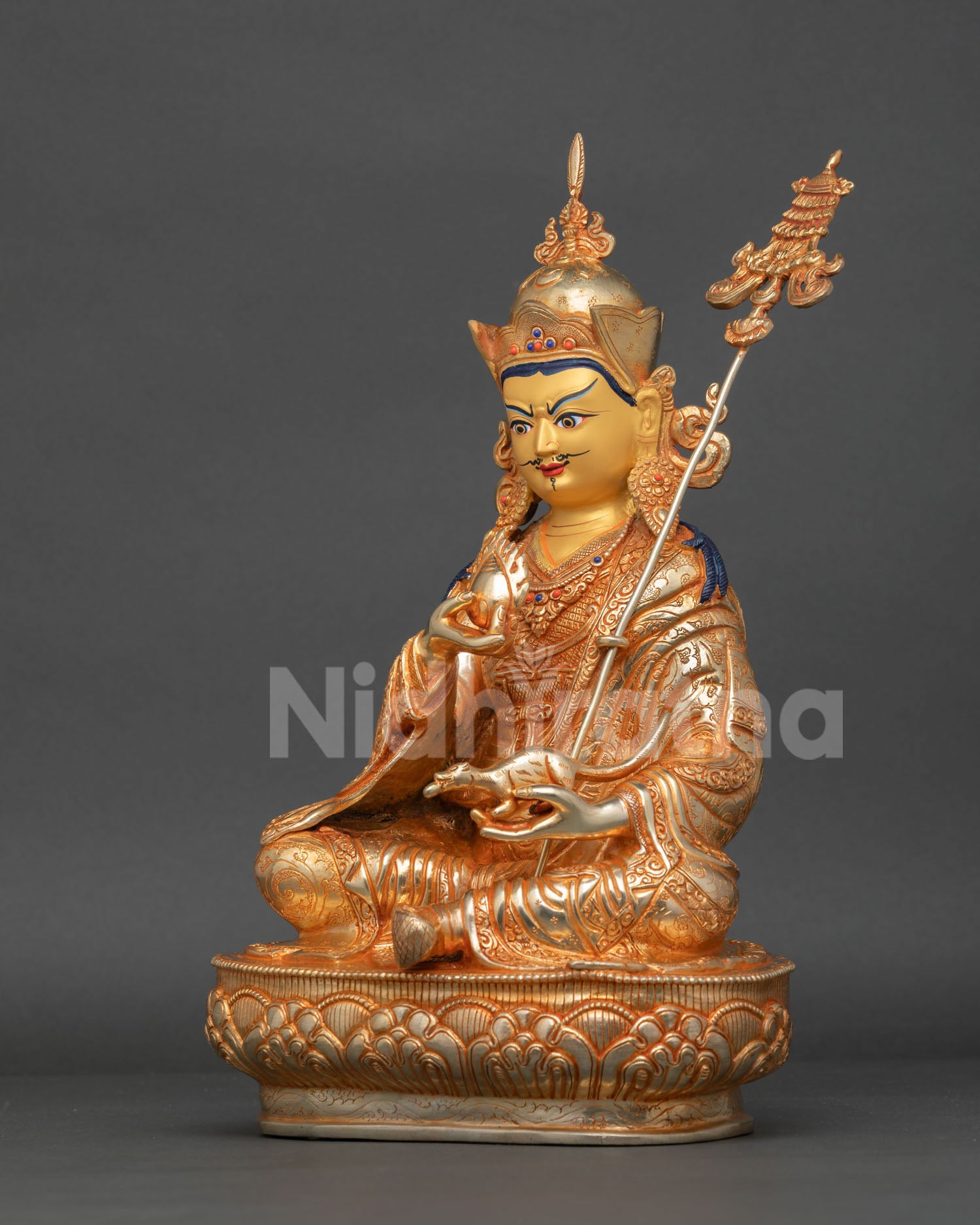 guru norlha holding chintamani jewel mongoose and trident symbols of abundance and enlightened wealth