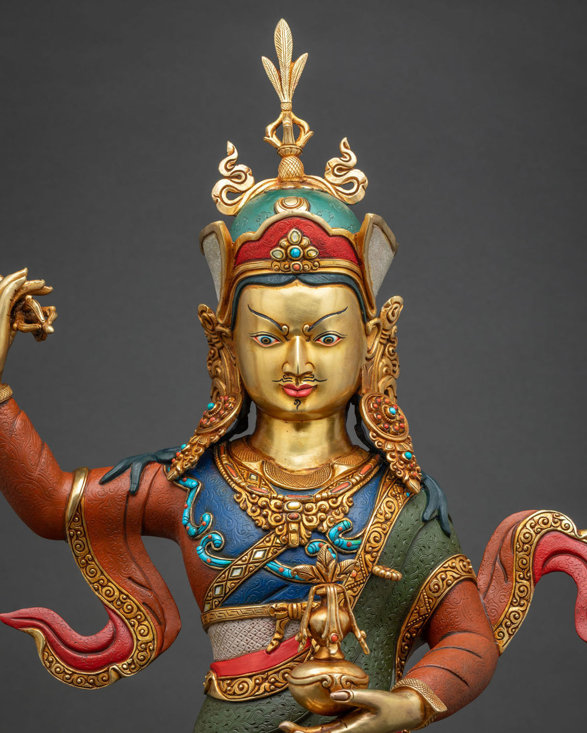 Guru Rinpoche Padmasambhava statue close-up, ornate crown and jeweled halo detail