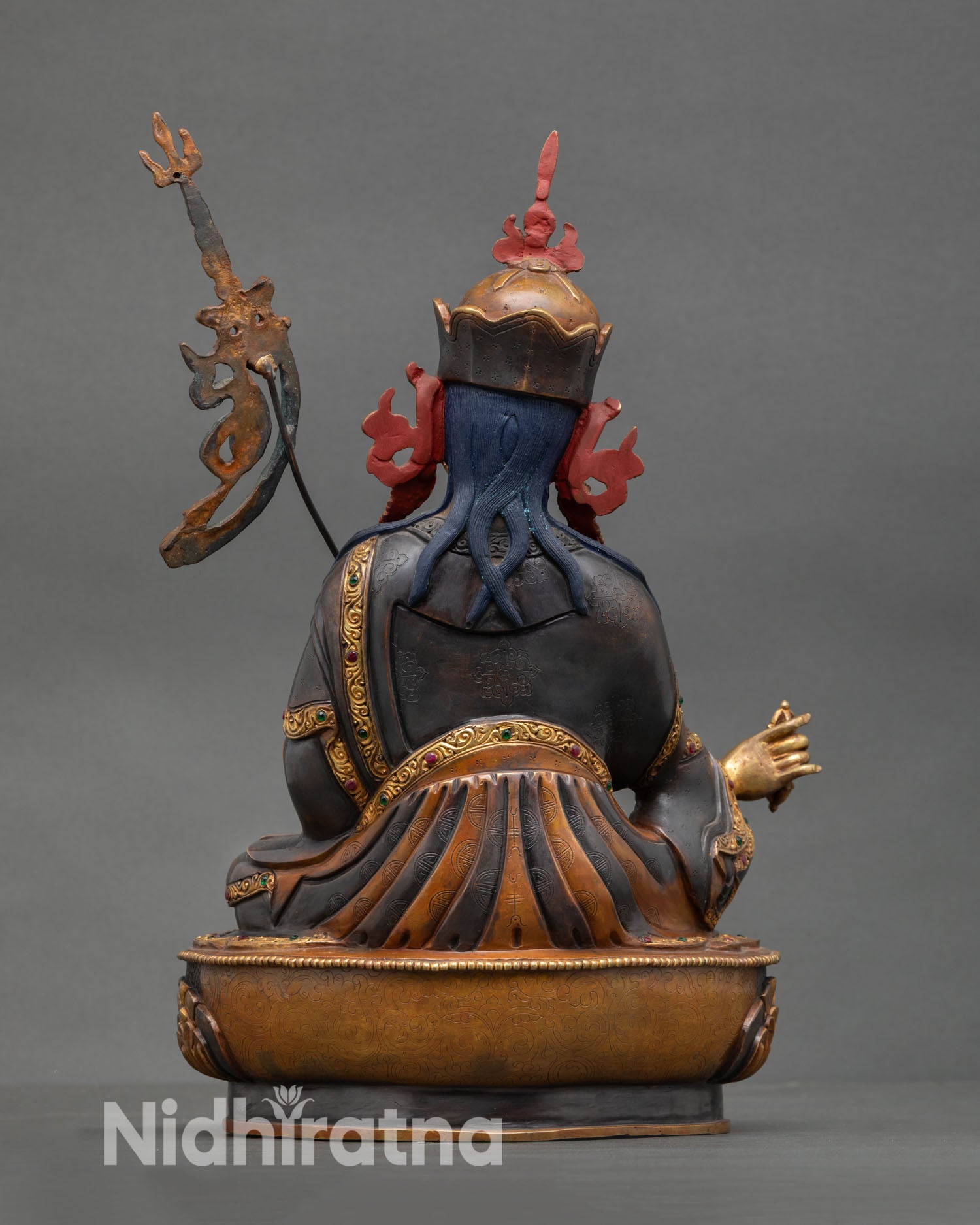 Guru Rinpoche statue back view intricate carving oxidized gold gilded finish sacred altar decor spiritual wisdom compassion deity statue