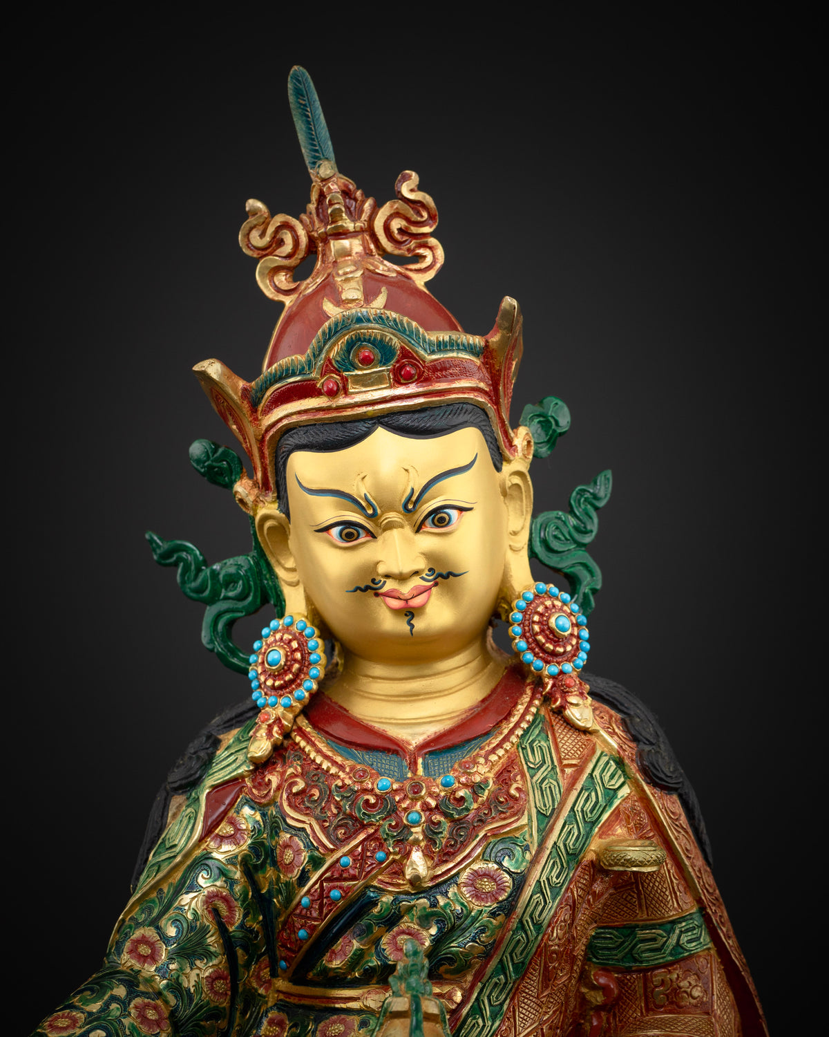 Guru Rinpoche statue face and crown close-up, 24K gold painted face with turquoise and coral jewelry