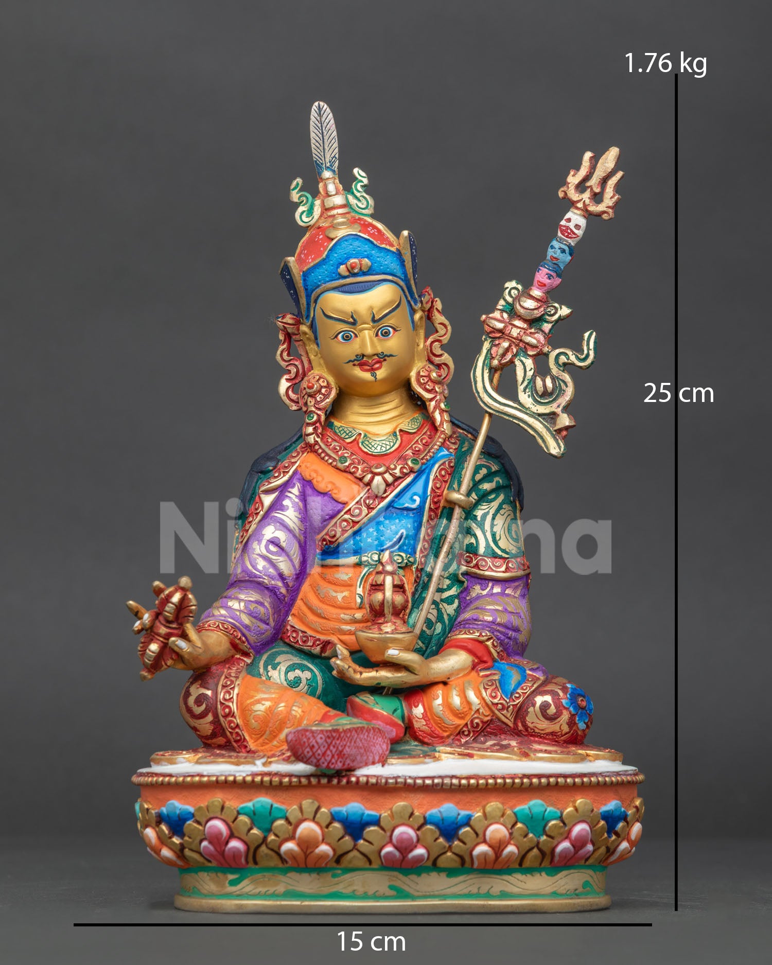 Guru Rinpoche statue from Patan Nepal with gold painted face and colorful lotus pedestal.