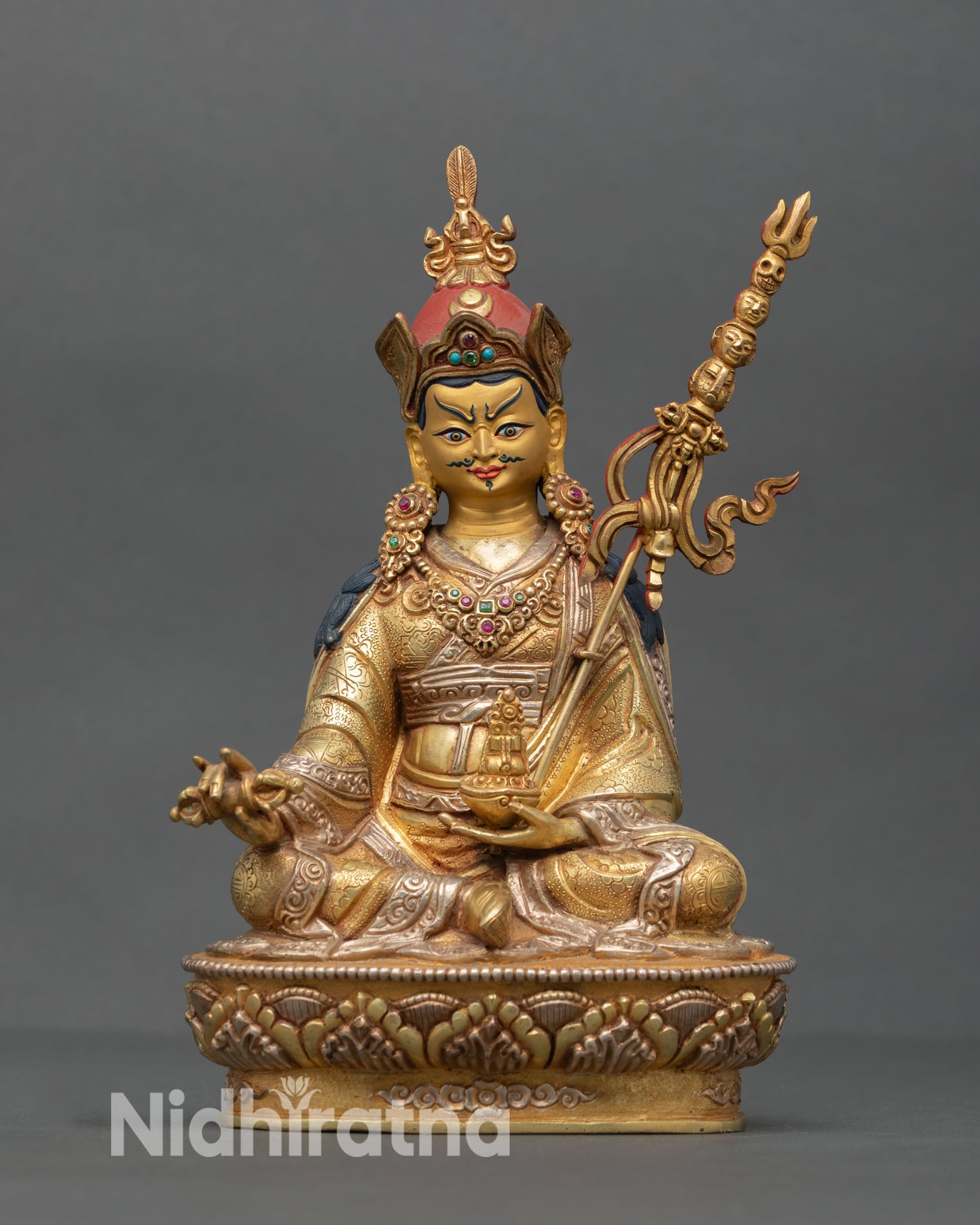 Guru Rinpoche statue front view copper sculpture 24K gold gilded face semi precious stones lost wax casting Nepal Newari artisan