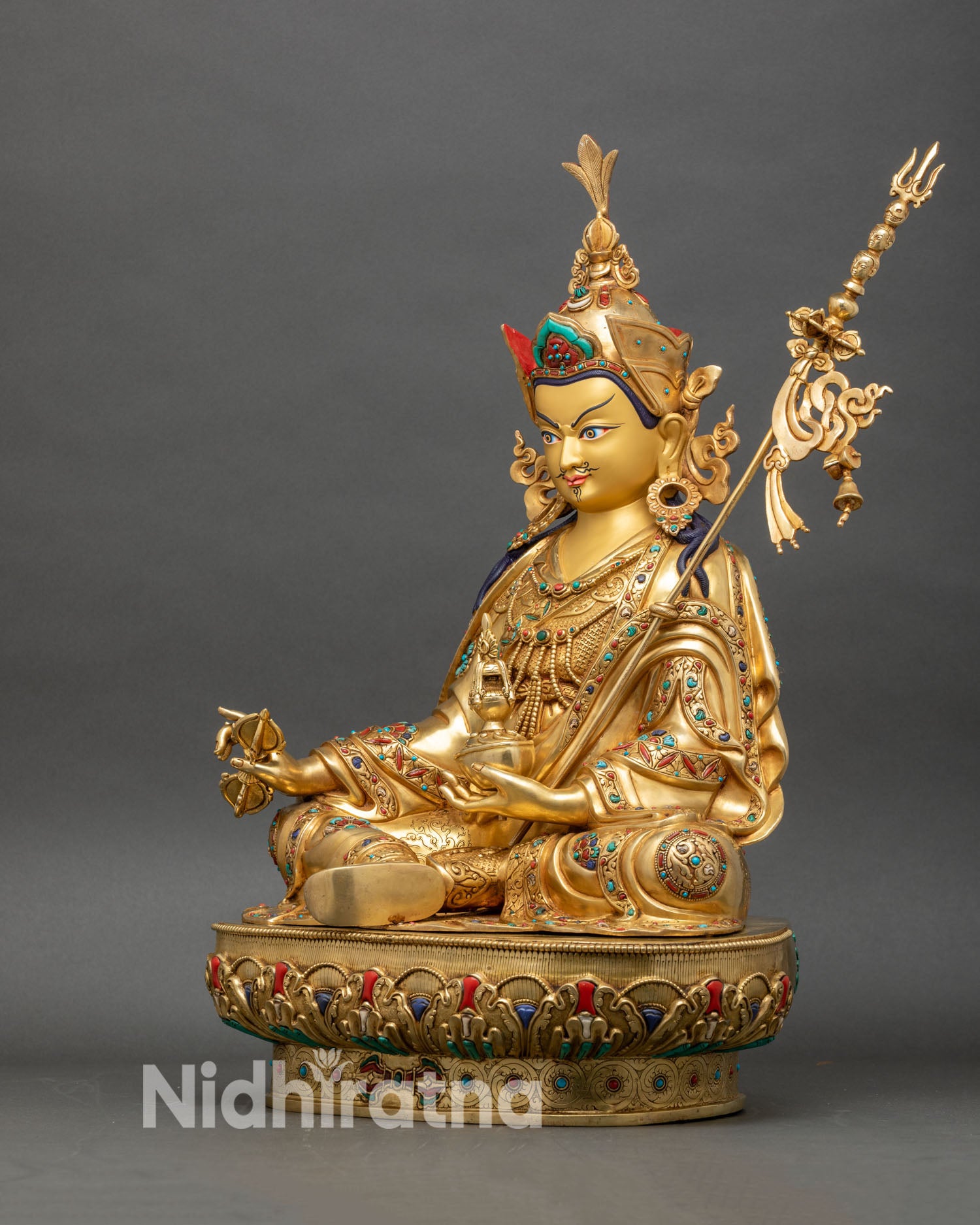 Guru Rinpoche statue left profile gold copper craftsmanship and lotus base
