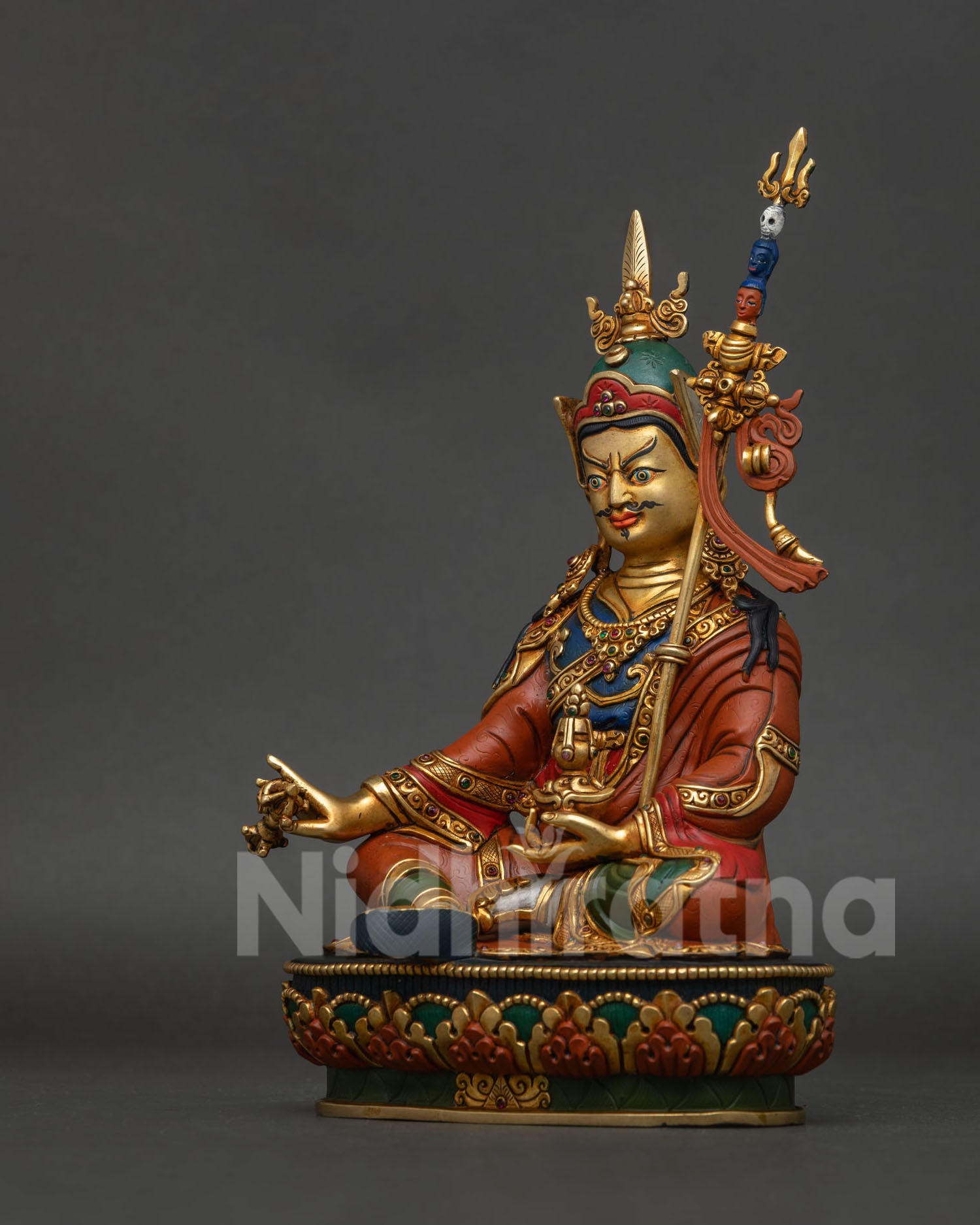 Guru Rinpoche Statue left side view with vajra and skull cup details