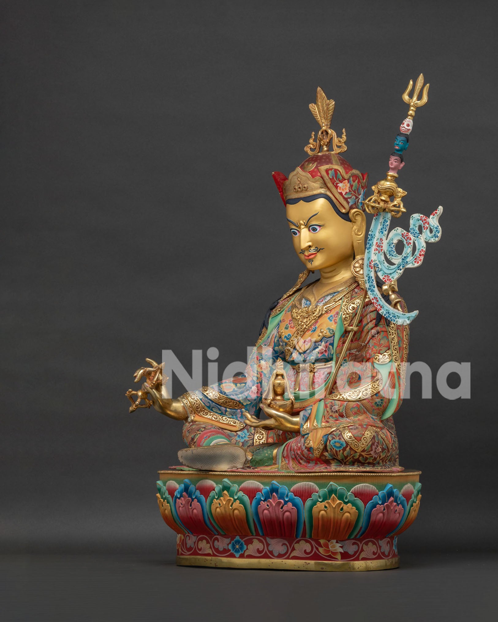 Guru Rinpoche statue left view side showing skull cup, khatvanga and intricate gilded ornaments