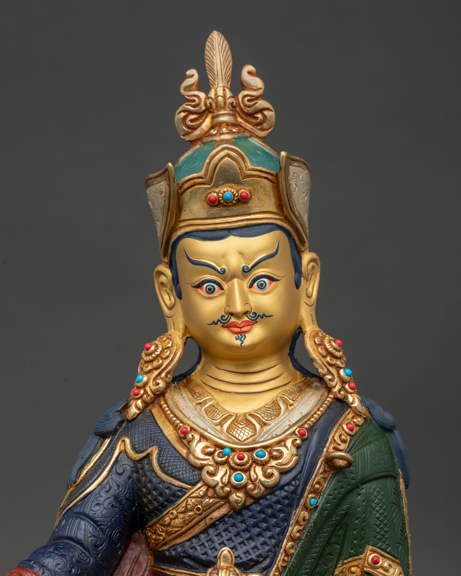 Guru Rinpoche Statue regular close up showing copper craftsmanship and colorful Padmasambhava details