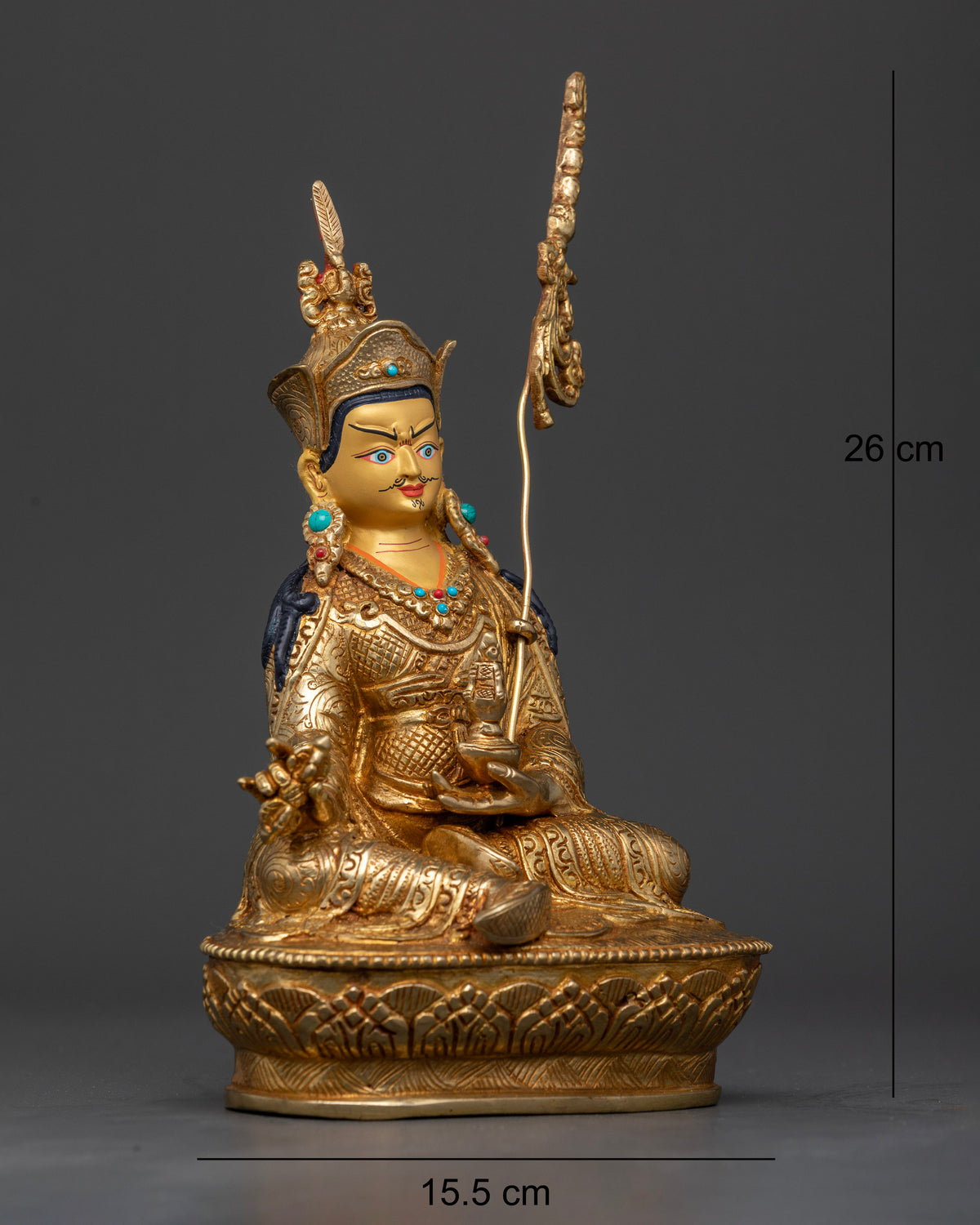 Guru Rinpoche statue seated on hand carved lotus pedestal with khatvanga.