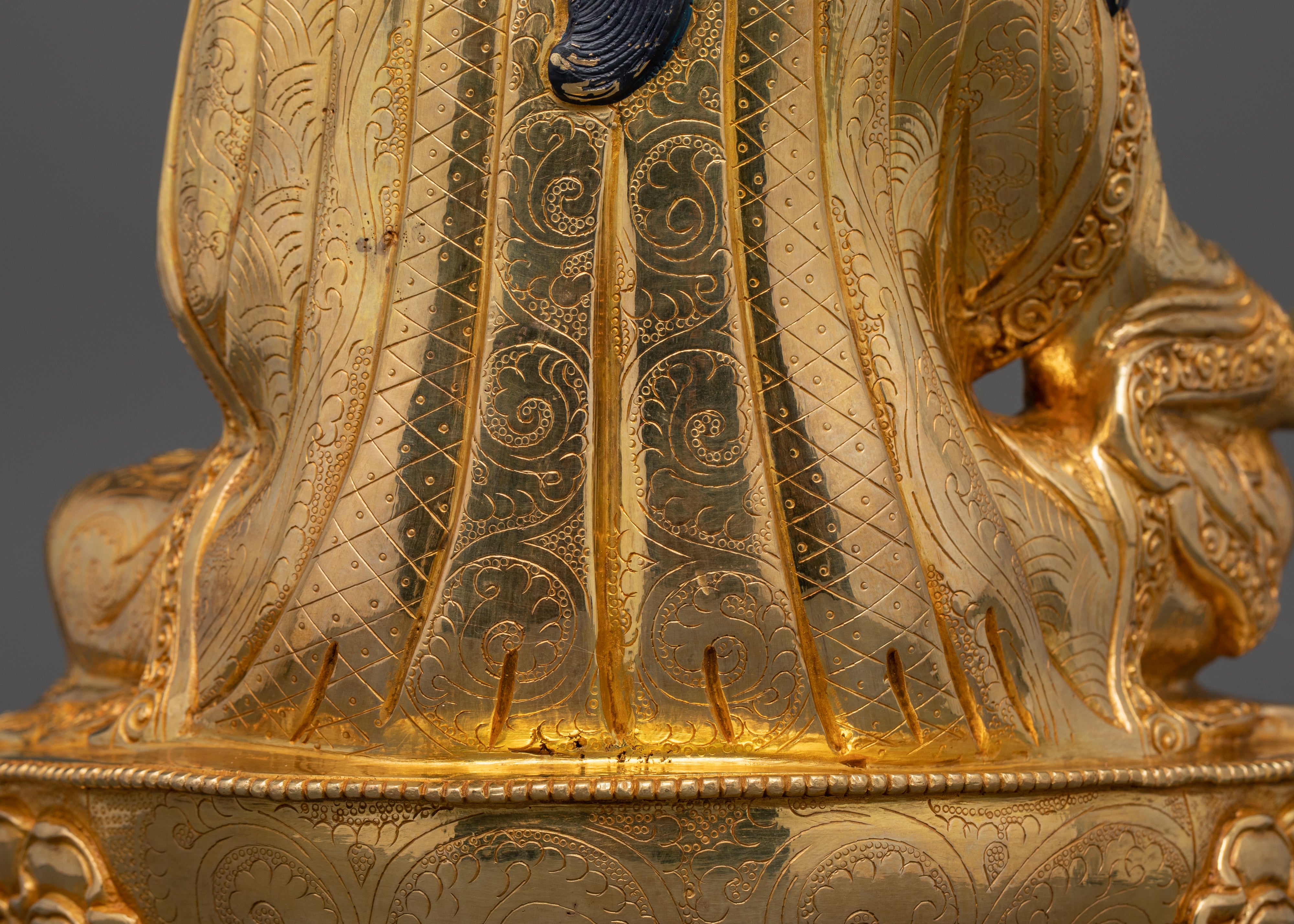 the back profile of guru rinpoche sculpture