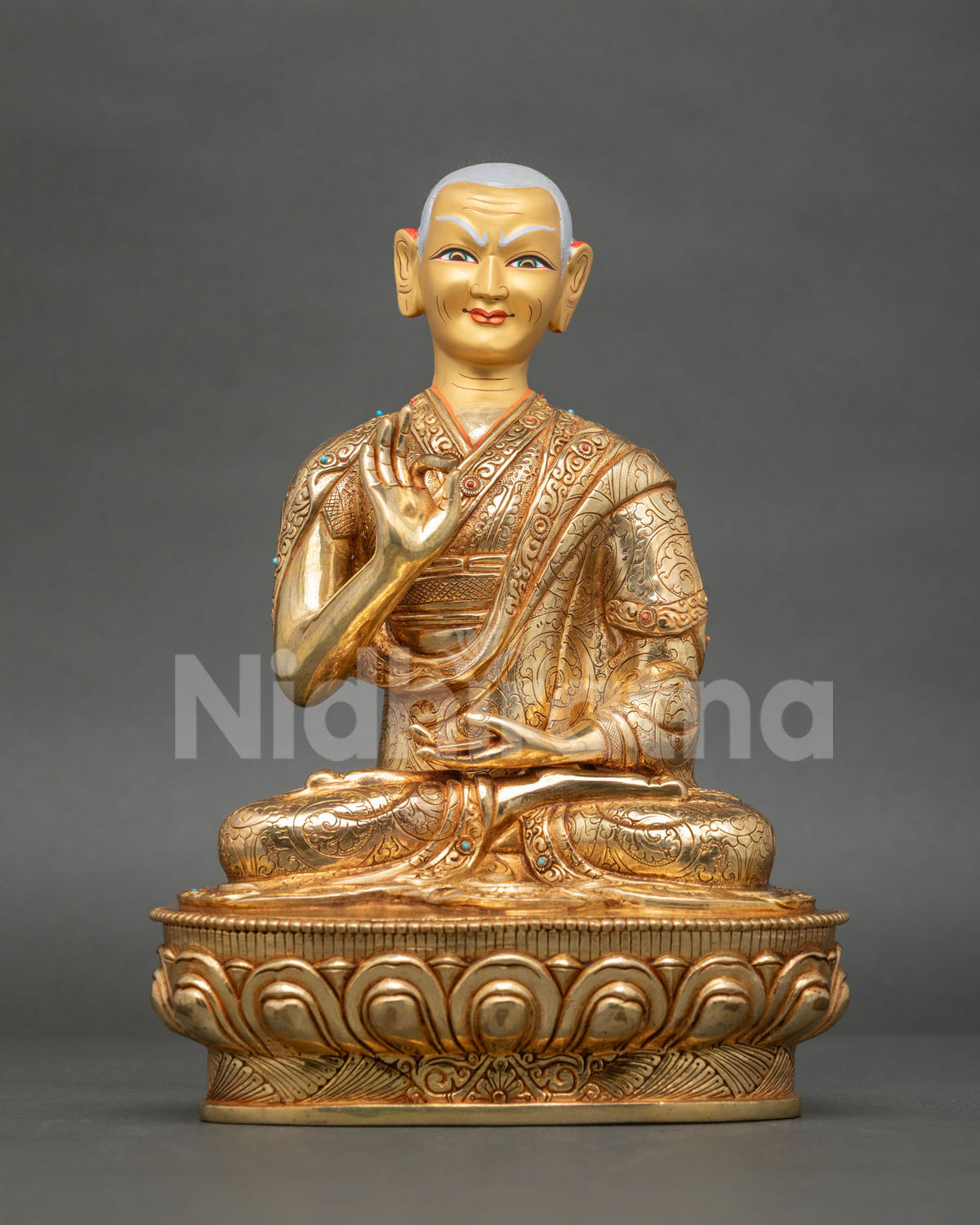 Gyaltsab Je and Khedrup Je statues in monastic robes with intricate gold-gilded details