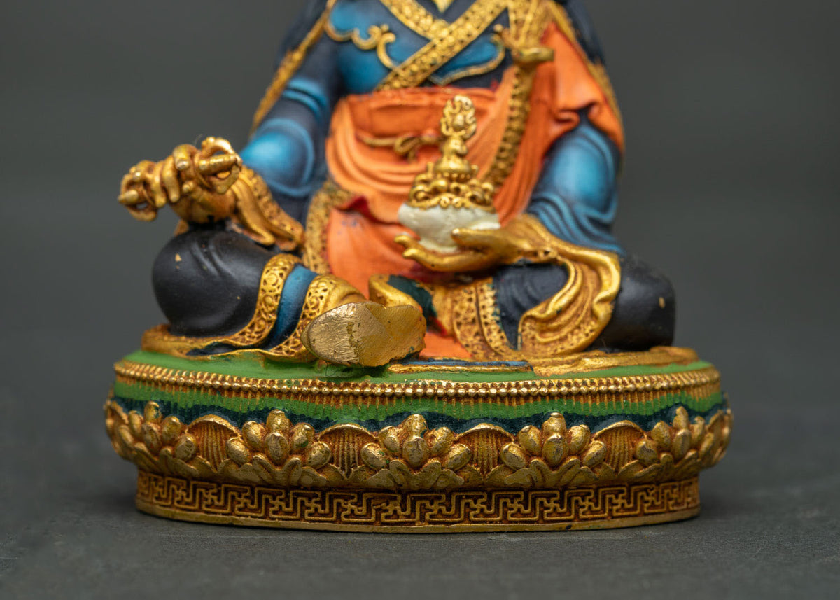 Hand-carved lotus base and Kapala skull cup detail on a handcrafted Nepalese Buddhist statue.