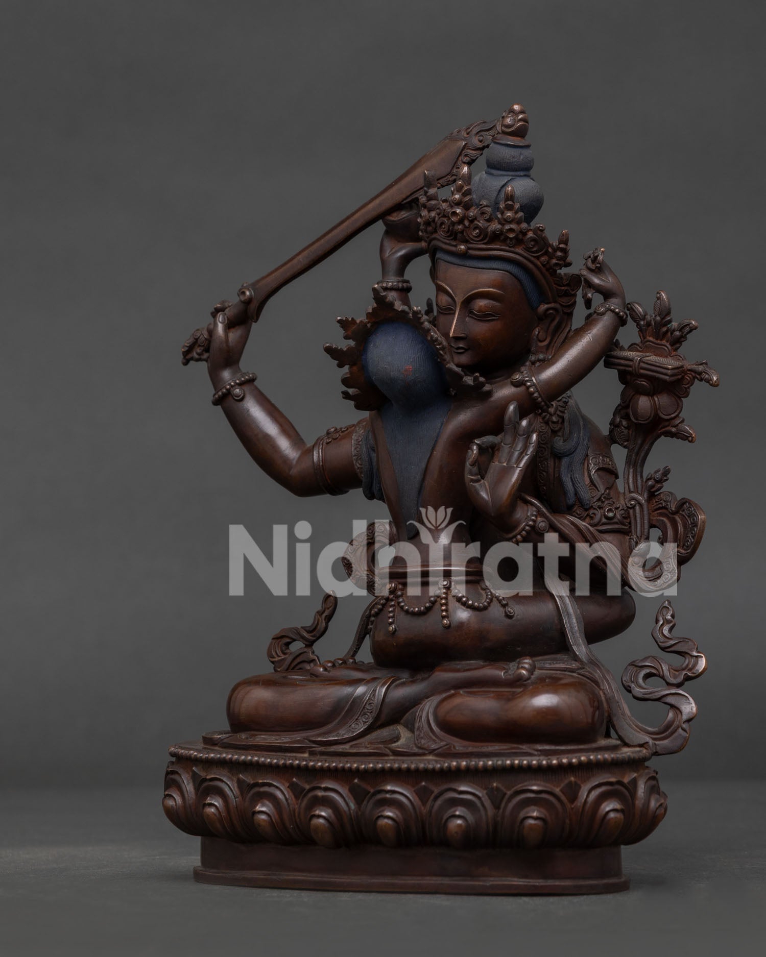 Hand Carved Silk Garments on Oxidized Manjushri Statue.