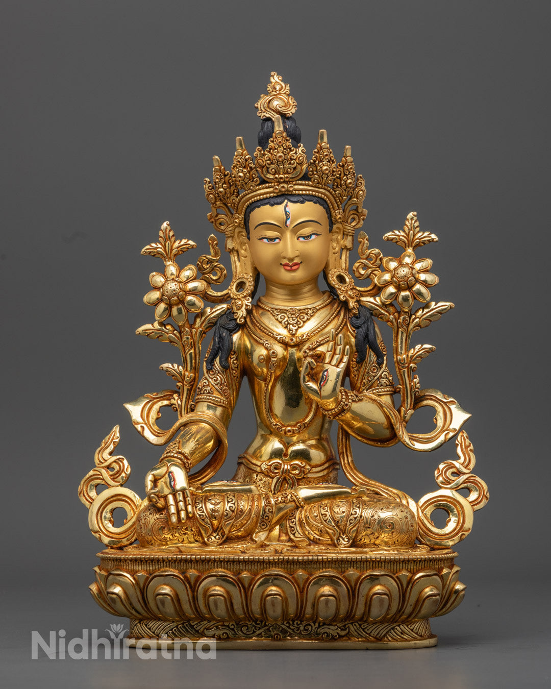 hand-carved 24k gold-gilded White Tara Statue seated on a lotus throne, adorned with semi-precious stones – symbolizing healing, serenity, and long life.