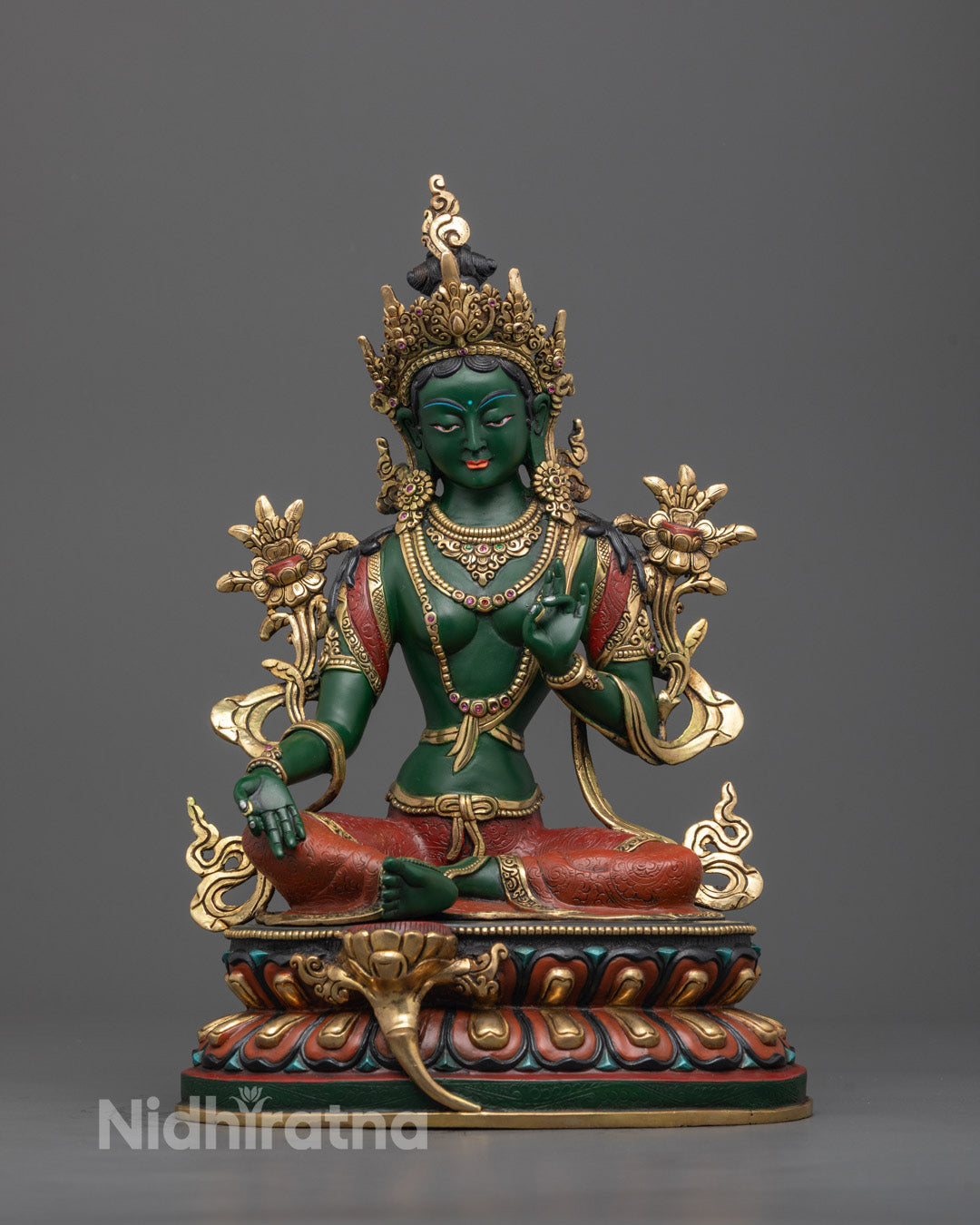 Front view of hand-carved Green Tara Statue with 24k gold gilding